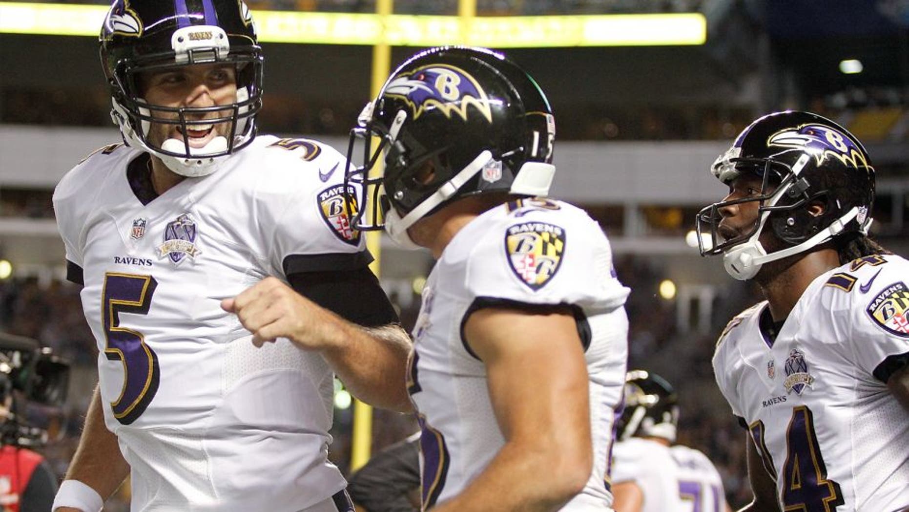 PITTSBURGH, PA - OCTOBER 01: Joe Flacco #5 and Michael Campanaro of the Baltimore Ravens celebrate after Campanaro scored a 1st quarter touchdown during the game against the Pittsburgh Steelers at Heinz Field on October 1, 2015 in Pittsburgh, Pennsylvania. (Photo by Justin K. Aller/Getty Images)