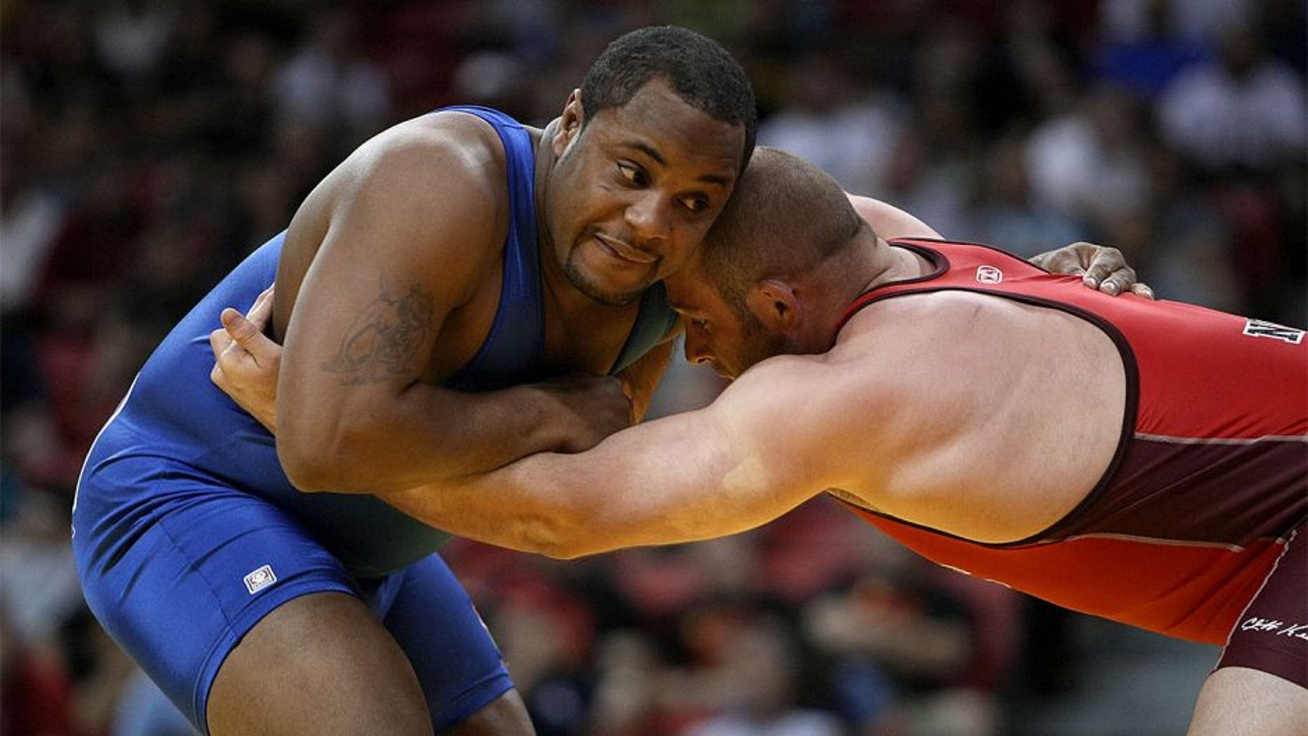 LAS VEGAS - JUNE 15: Daniel Cormier (blue) wrestles Damion Hahn (red) in the Freestyle 96kg division championship match during the USA Olympic trials for wrestling and judo on June 15, 2008 at the Thomas & Mack Center in Las Vegas, Neveda. (Photo by Jonathan Ferrey/Getty Images)