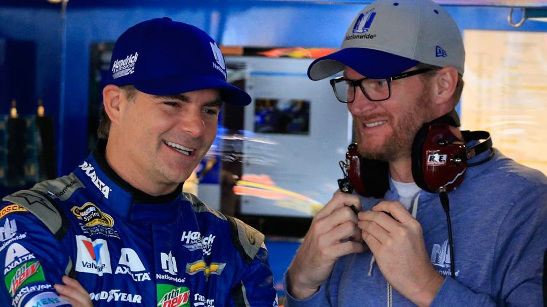 DOVER, DE - OCTOBER 01: Jeff Gordon (L), driver of the #88 Nationwide Chevrolet, talks with NASCAR Sprint Cup Series driver Dale Earnhardt Jr. in the garage area during practice for the NASCAR Sprint Cup Series Citizen Solider 400 at Dover International Speedway on October 1, 2016 in Dover, Delaware. (Photo by Chris Trotman/Getty Images)