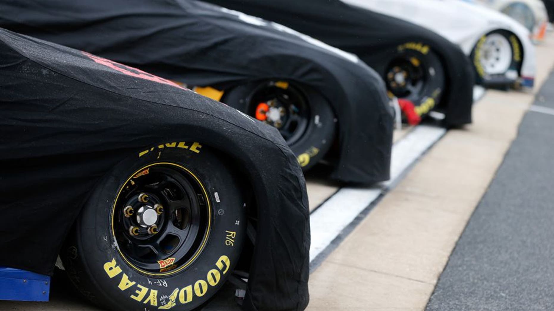 DOVER, DE - SEPTEMBER 30: Cars sit on the grid prior to qualifying for the NASCAR Sprint Cup Series Citizen Solider 400 at Dover International Speedway on September 30, 2016 in Dover, Delaware. Qualifying was cancelled due to weather.(Photo by Brian Lawdermilk/Getty Images)