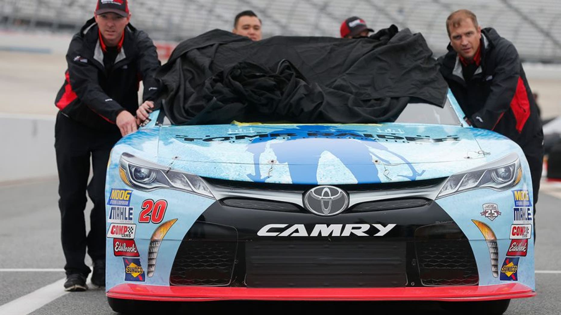 DOVER, DE - OCTOBER 01: Crew members push the #20 GameStop/Rise of the Tomb Raider: 20 Year Celebration Toyota, driven by Erik Jones (not pictured), during qualifying for the NASCAR XFINITY Series Drive Sober 200 at Dover International Speedway on October 1, 2016 in Dover, Delaware. (Photo by Brian Lawdermilk/Getty Images)
