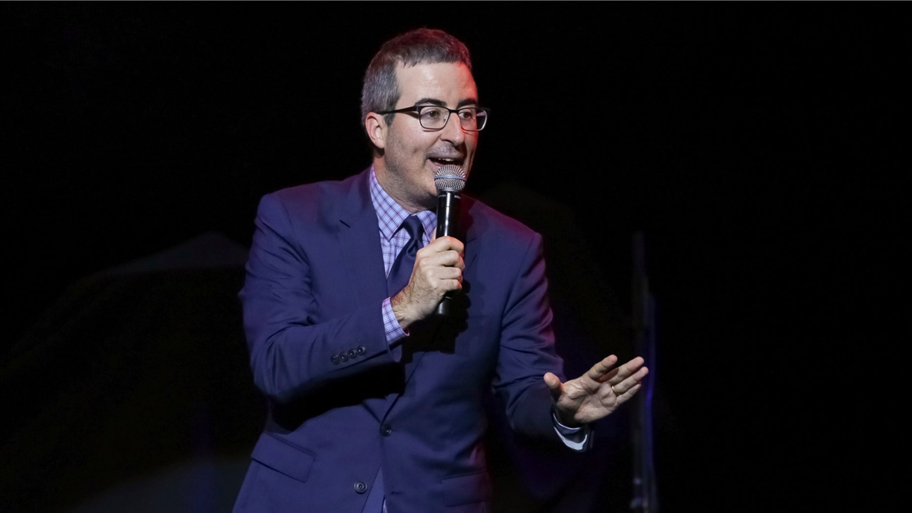 FILE - In this Nov. 7, 2017 file photo, comedian John Oliver performs at the 11th Annual Stand Up for Heroes benefit in New York. Oliver's show, which begins its fifth season on Sunday. (Photo by Brent N. Clarke/Invision/AP, File)