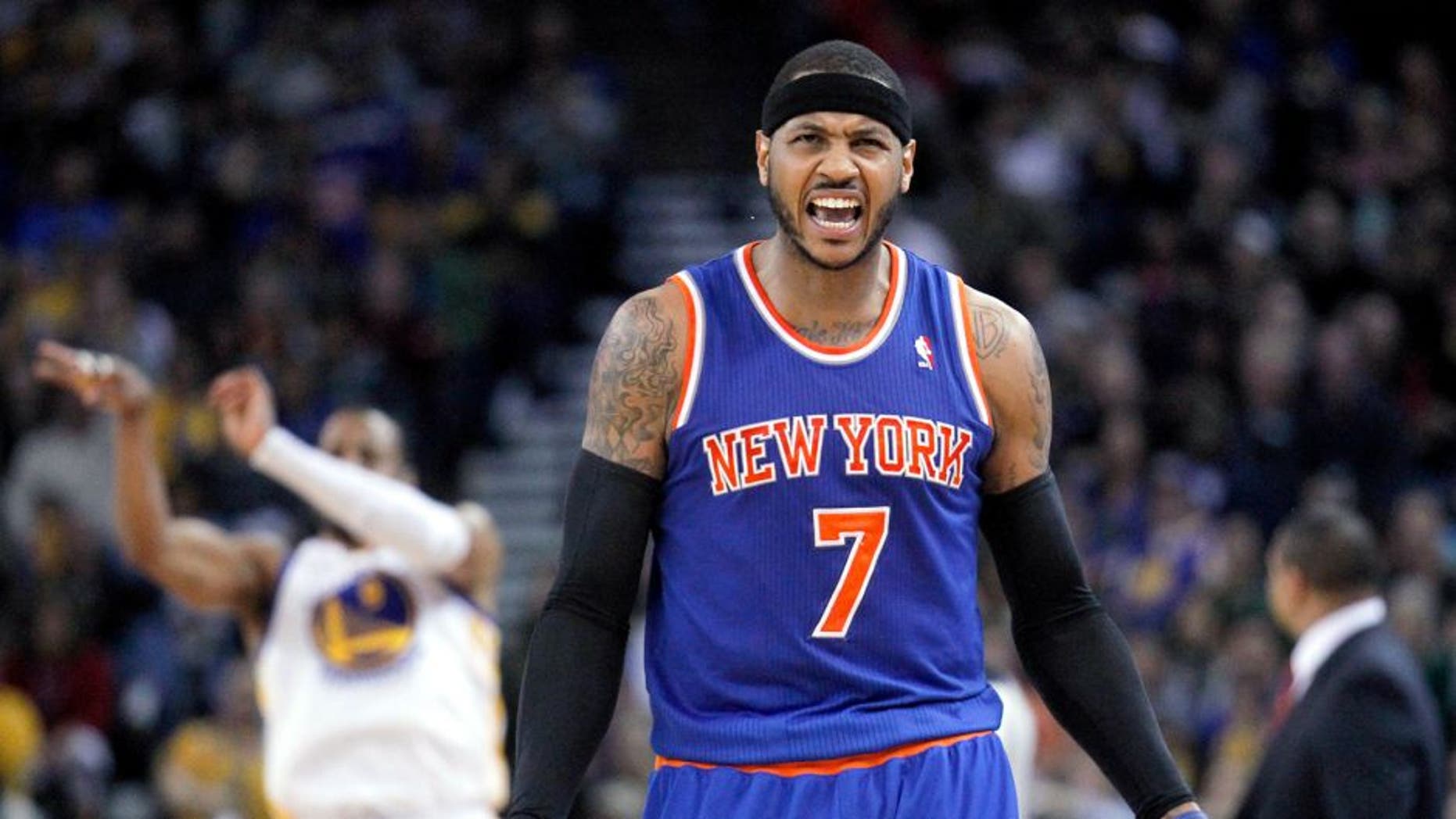 Mar 30, 2014; Oakland, CA, USA; New York Knicks forward Carmelo Anthony (7) reacts on the court against the Golden State Warriors in the fourth quarter at Oracle Arena. The Knicks won 89-84. Mandatory Credit: Cary Edmondson-USA TODAY Sports