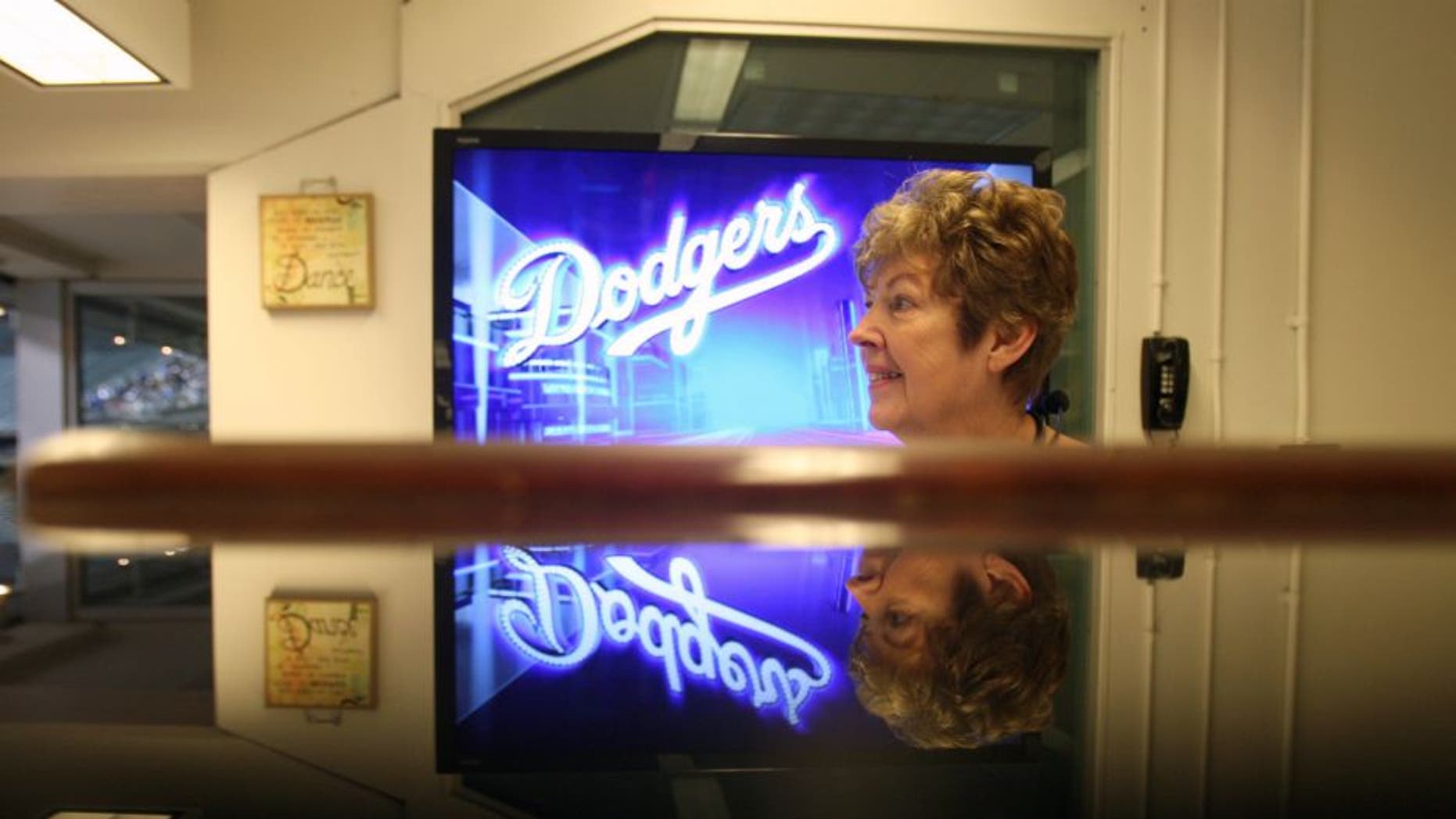 7:38pm April 4: Organist Nancy Bea Hefley watches the game for musical cues during the Dodgers– Angels exhibition Freeway Series game. Hefley has been playing since the late 1980s alongside announcers Rick Monday and Vin Scully and became one of the crowd favorites at Dodger Stadium. She plays popular pop and rock songs as well as older and less commonly played numbers. (Photo by Allen J. Schaben/Los Angeles Times via Getty Images)