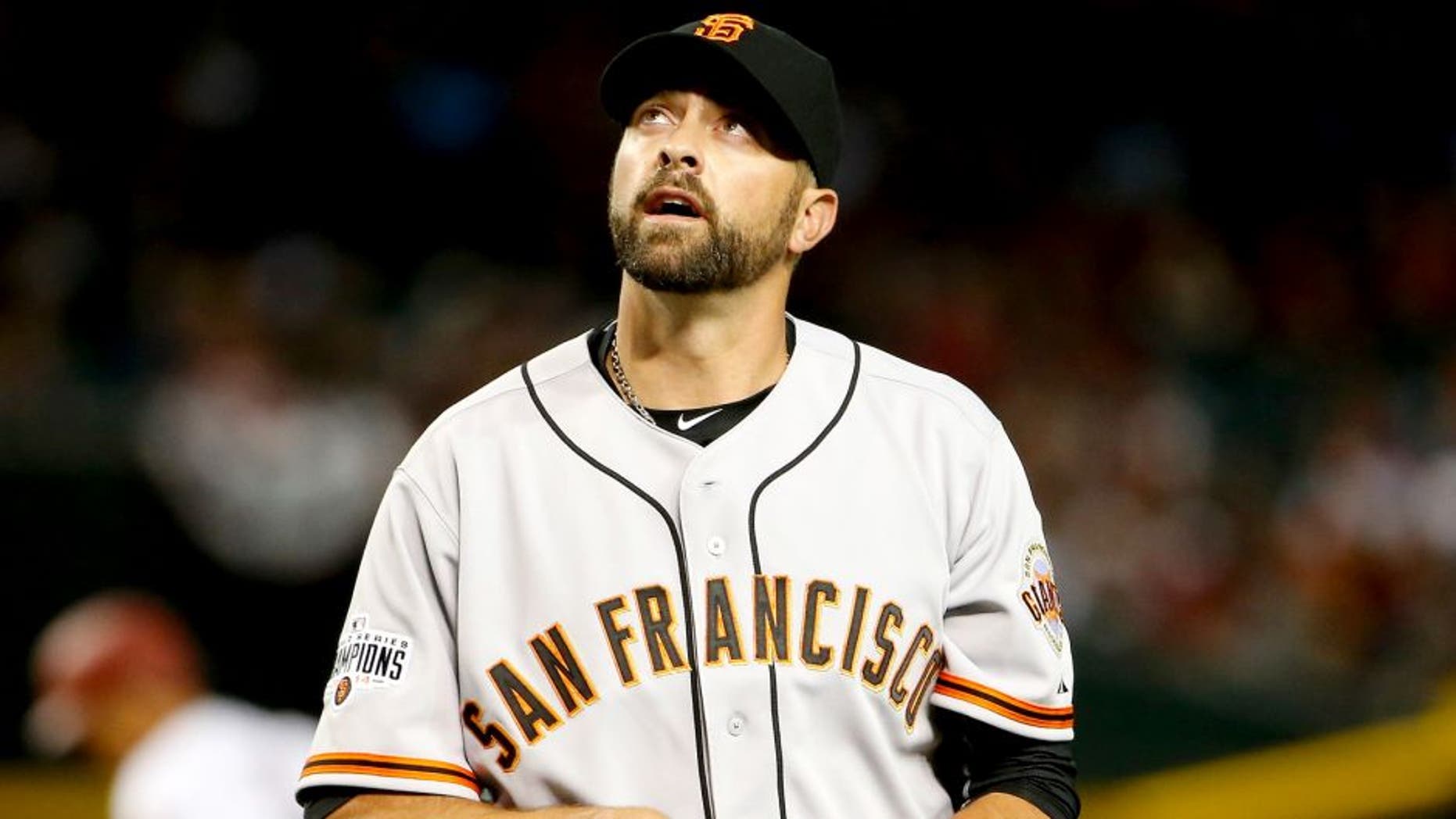PHOENIX, AZ - APRIL 06: Relief pitcher Jeremy Affeldt #41 of the San Francisco Giants reacts after pitching against the Arizona Diamondbacks during the Opening Day MLB game at Chase Field on April 6, 2015 in Phoenix, Arizona. The Giants defeated the Diamondbacks 5-4. (Photo by Christian Petersen/Getty Images)