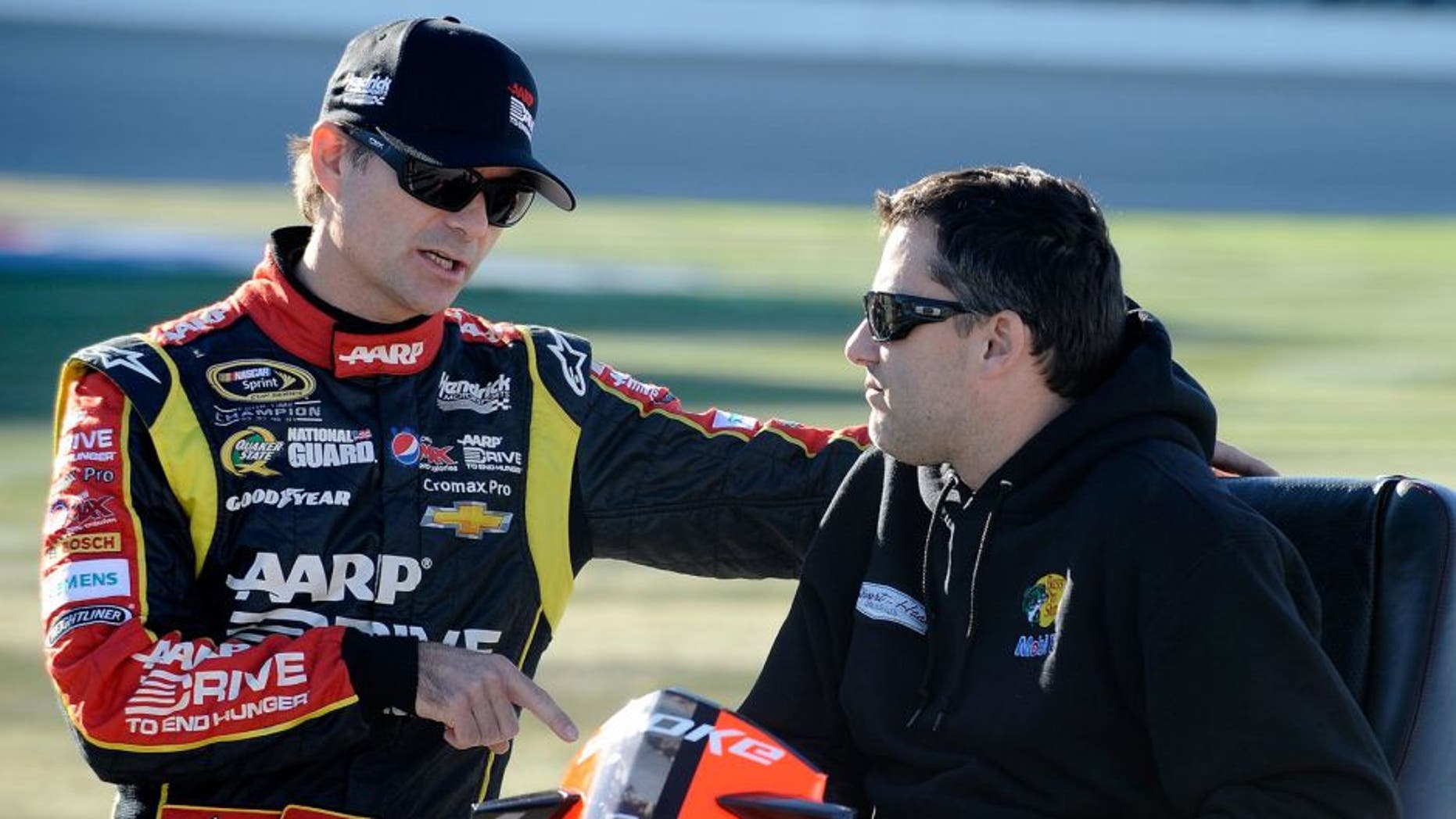 JOLIET, IL - SEPTEMBER 13: Jeff Gordon, driver of the #24 Drive To End Hunger Chevrolet, speaks with Tony Stewart during qualifying for the NASCAR Sprint Cup Series Geico 400 at Chicagoland Speedway on September 13, 2013 in Joliet, Illinois. (Photo by Rainier Ehrhardt/NASCAR via Getty Images)