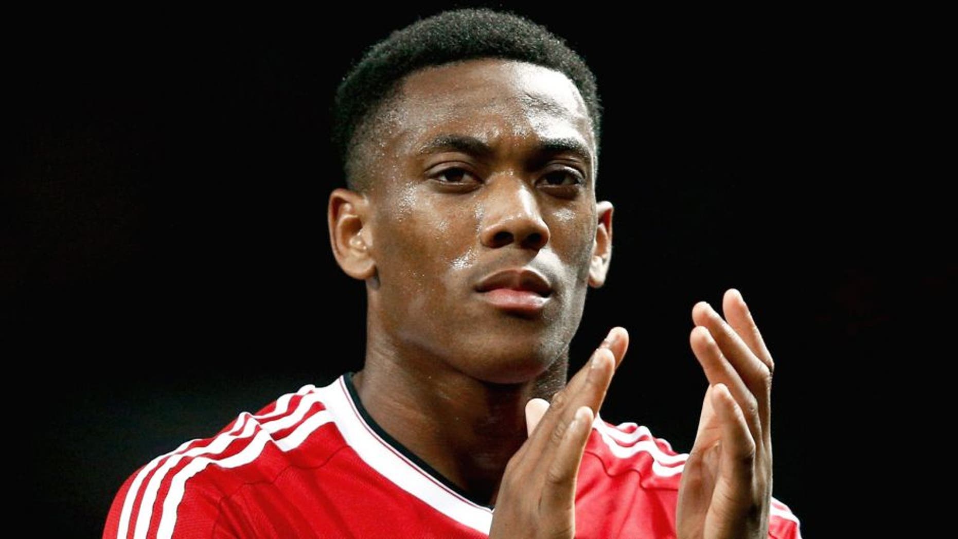 MANCHESTER, ENGLAND - SEPTEMBER 30: Anthony Martial of Manchester United applauds the crowd after victory in the UEFA Champions League Group B match between Manchester United FC and VfL Wolfsburg at Old Trafford on September 30, 2015 in Manchester, United Kingdom. (Photo by Dean Mouhtaropoulos/Getty Images)