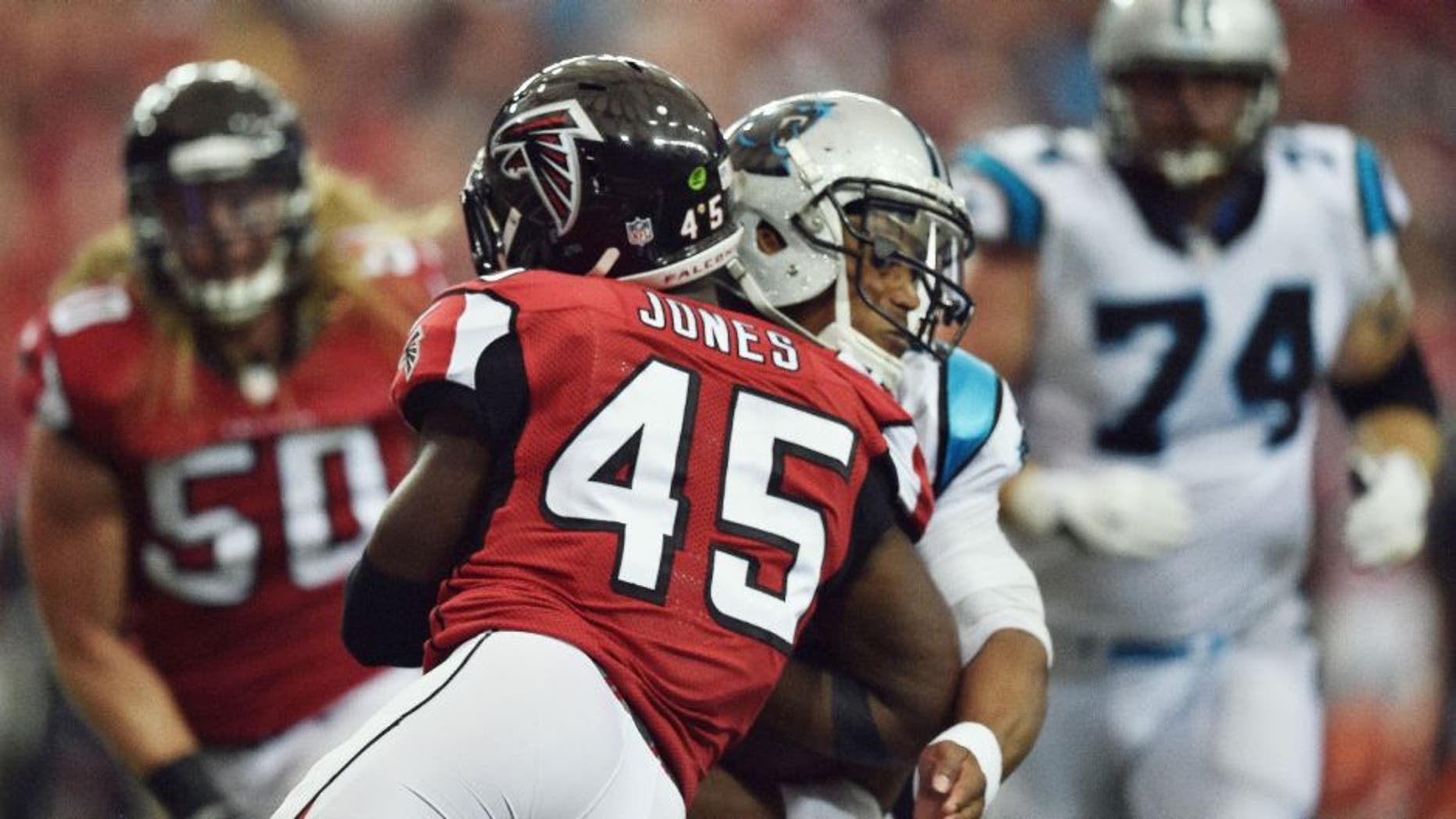 Carolina Panthers quarterback Cam Newton (1) is hit by Atlanta Falcons outside linebacker Deion Jones (45) during a two-point conversion during the second half of an NFL football game, Sunday, Oct. 2, 2016, in Atlanta. (AP Photo/Rainier Ehrhardt)