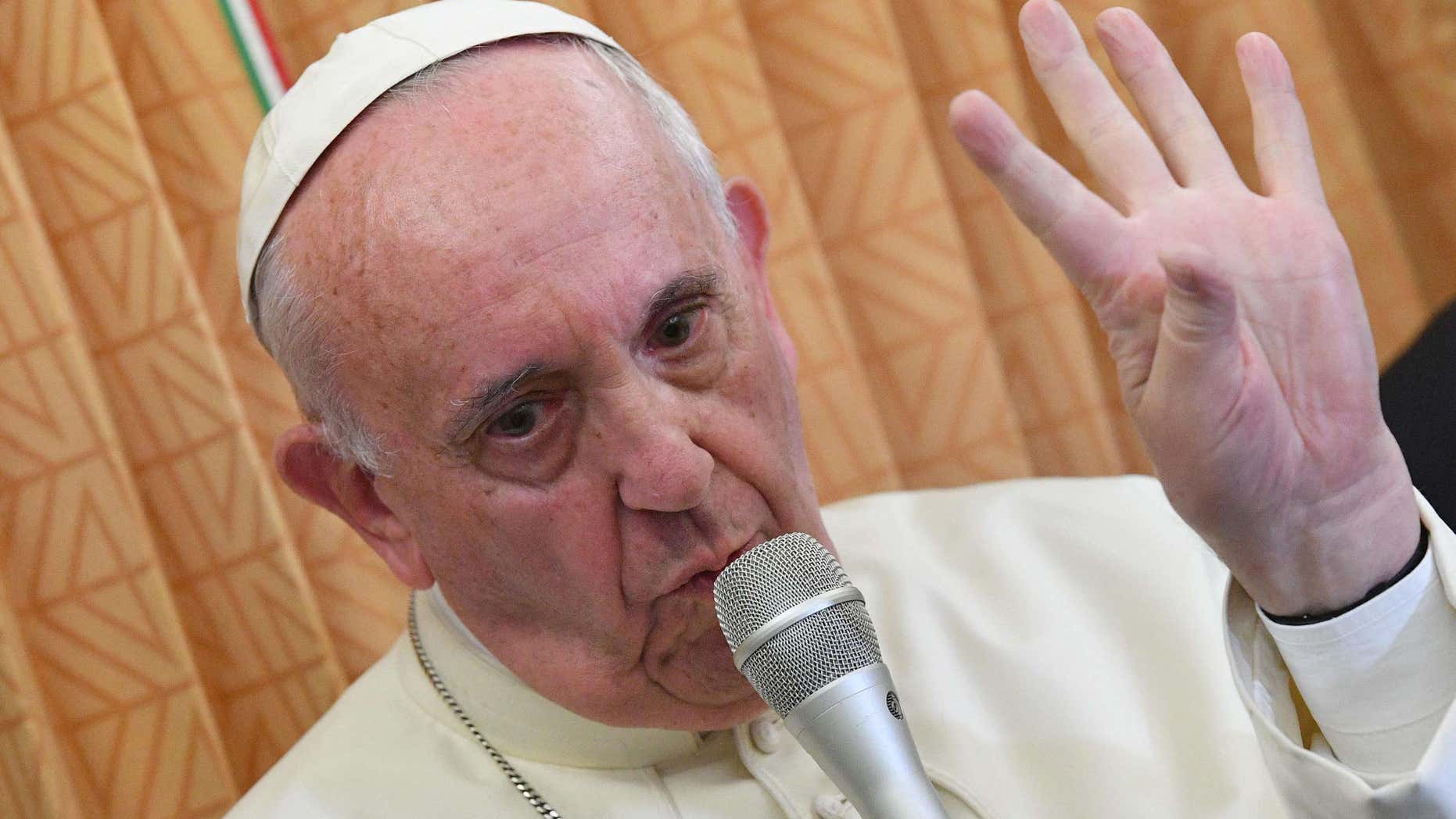Oct. 2, 2016: Pope Francis speaks with journalists on board the flight from Baku to Rome.