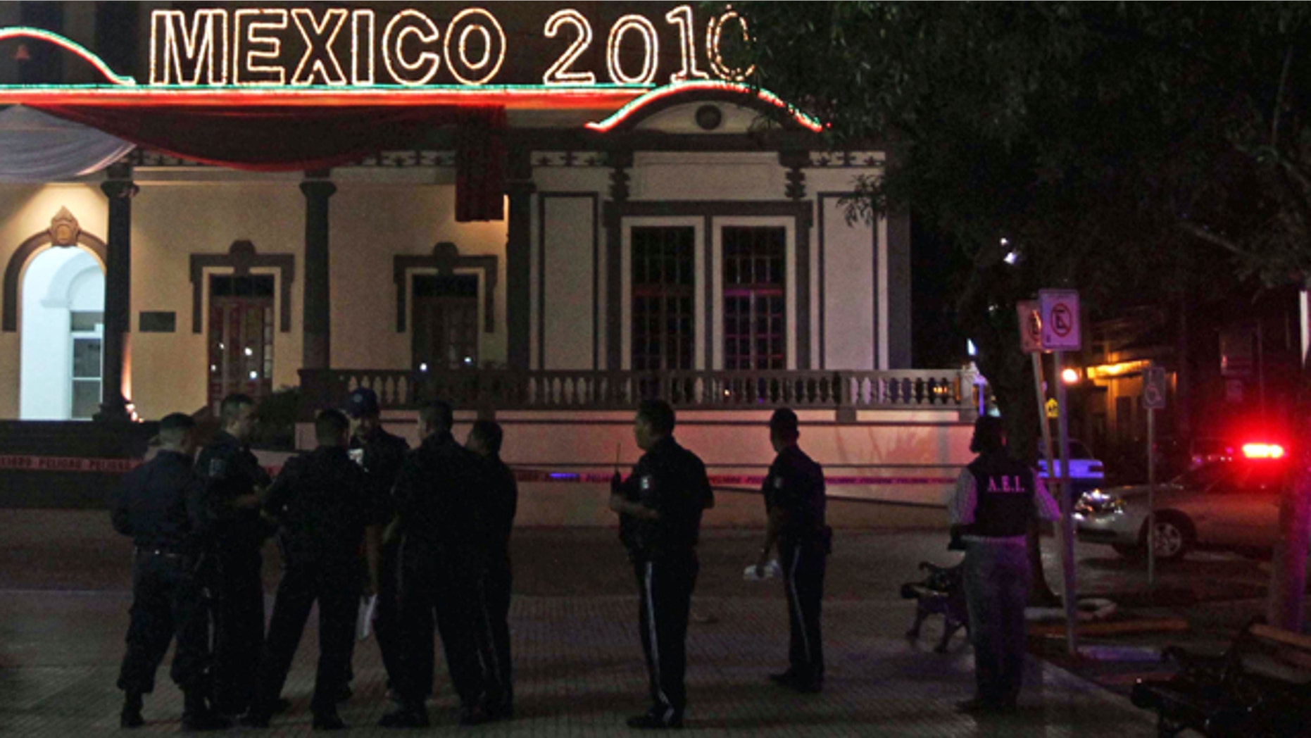 Oct. 2: Police officers stand at the area where a grenade was detonated by unidentified people, leaving at least 15 people injured, in front of the town hall in the municipality of Guadalupe, outskirts of Monterrey, northern Mexico.