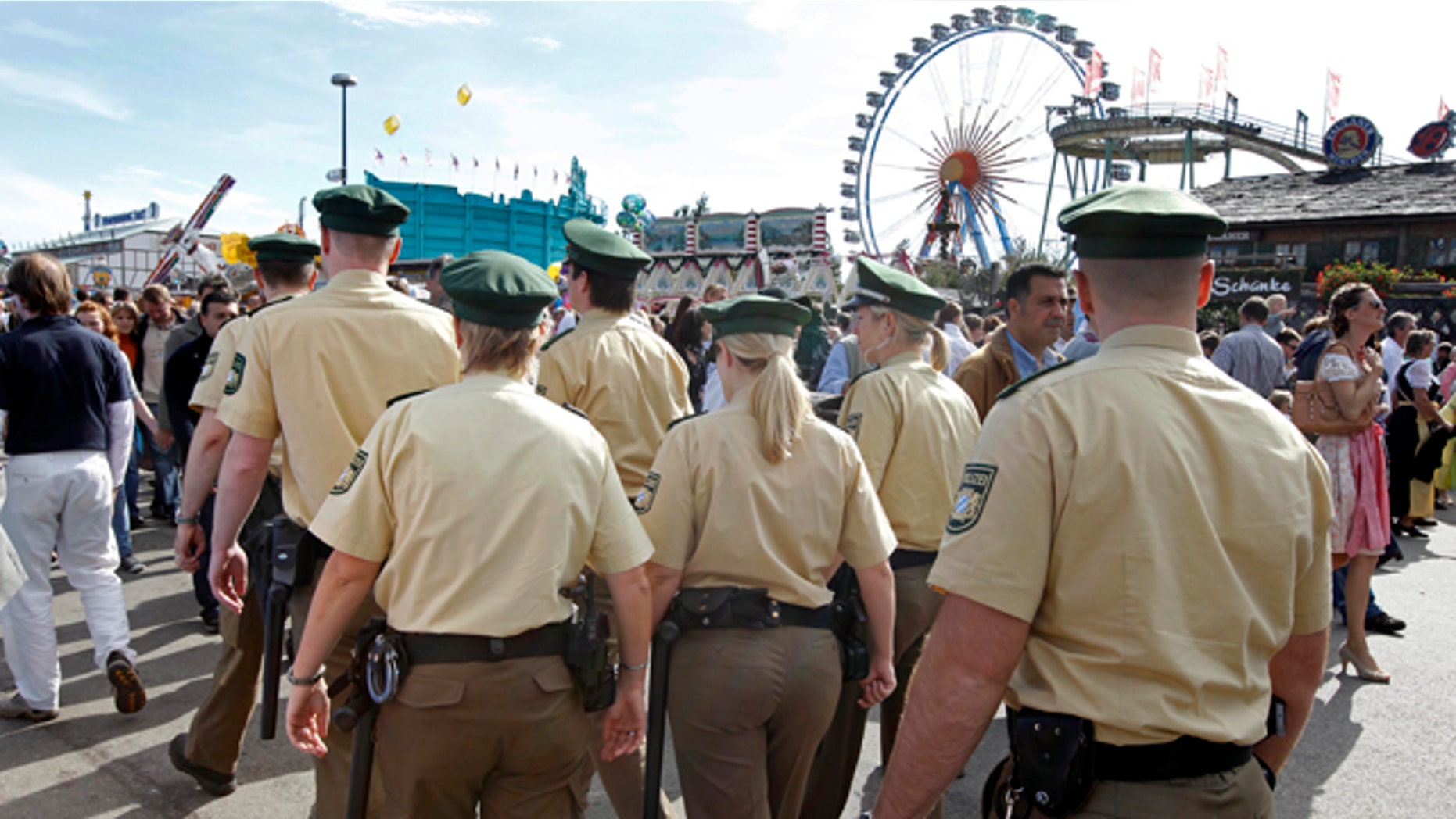 Oct. 3: Police officers patrol through the crowd at the Oktoberfest beer festival in Munich, southern Germany.