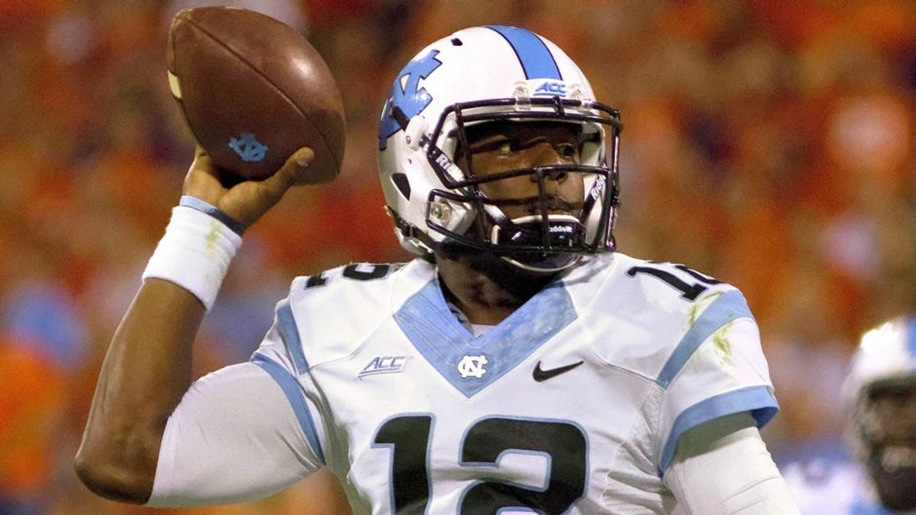 Sep 27, 2014; Clemson, SC, USA; North Carolina Tar Heels quarterback Marquise Williams (12) looks to pass the ball during the second quarter against the Clemson Tigers at Clemson Memorial Stadium. Mandatory Credit: Joshua S. Kelly-USA TODAY Sports