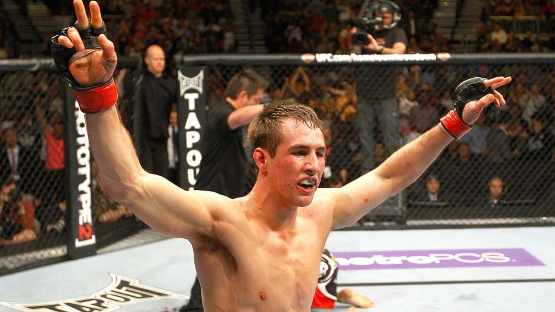 ATLANTA, GA - APRIL 21: Rory MacDonald celebrates as he defeats Che Mills by TKO during their welterweight bout for UFC 145 at Philips Arena on April 21, 2012 in Atlanta, Georgia. (Photo by Al Bello/Zuffa LLC/Zuffa LLC via Getty Images)