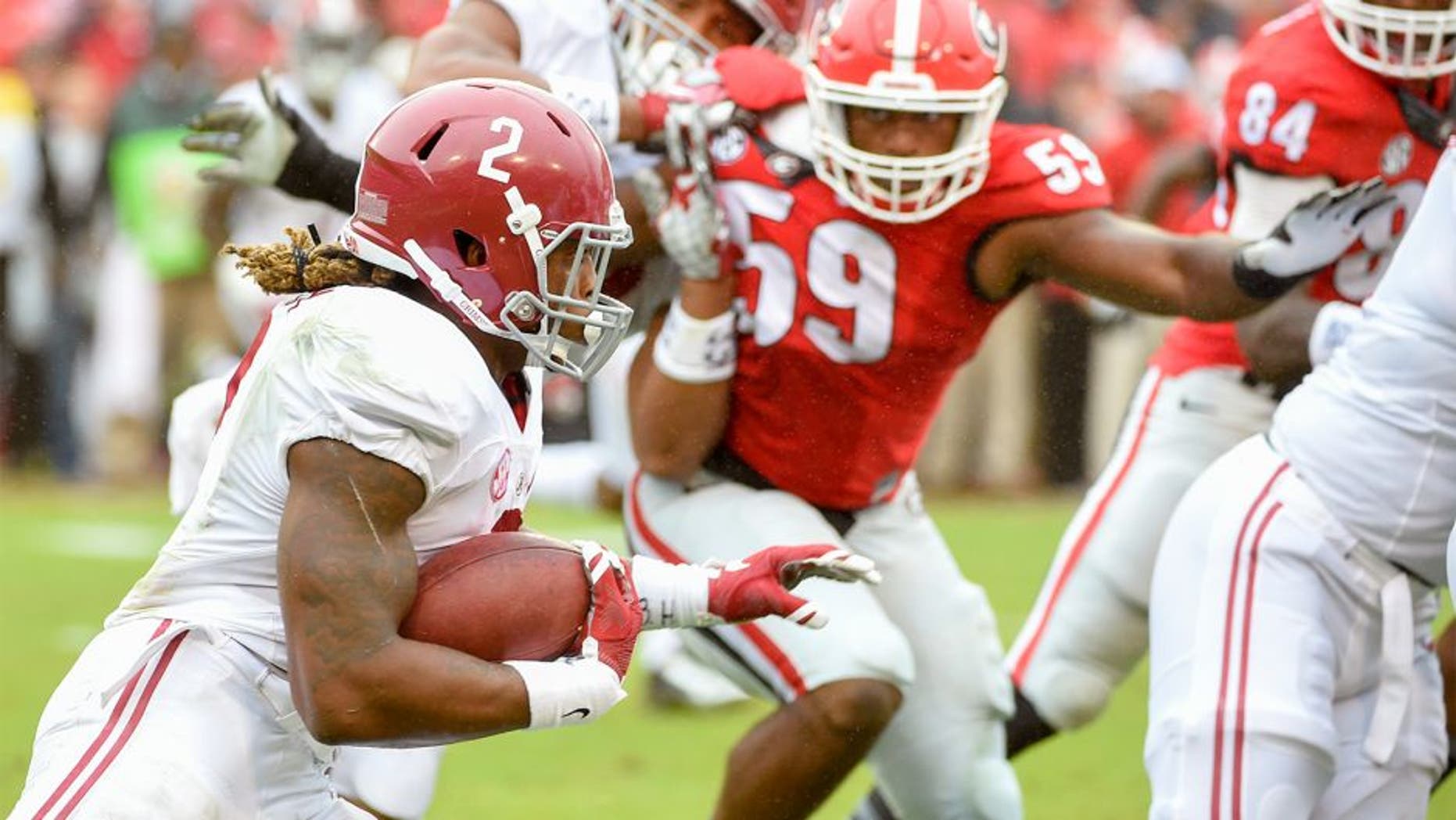 Oct 3, 2015; Athens, GA, USA; Alabama Crimson Tide running back Derrick Henry (2) runs the ball during the first quarter Georgia Bulldogs at Sanford Stadium. Mandatory Credit: John David Mercer-USA TODAY Sports