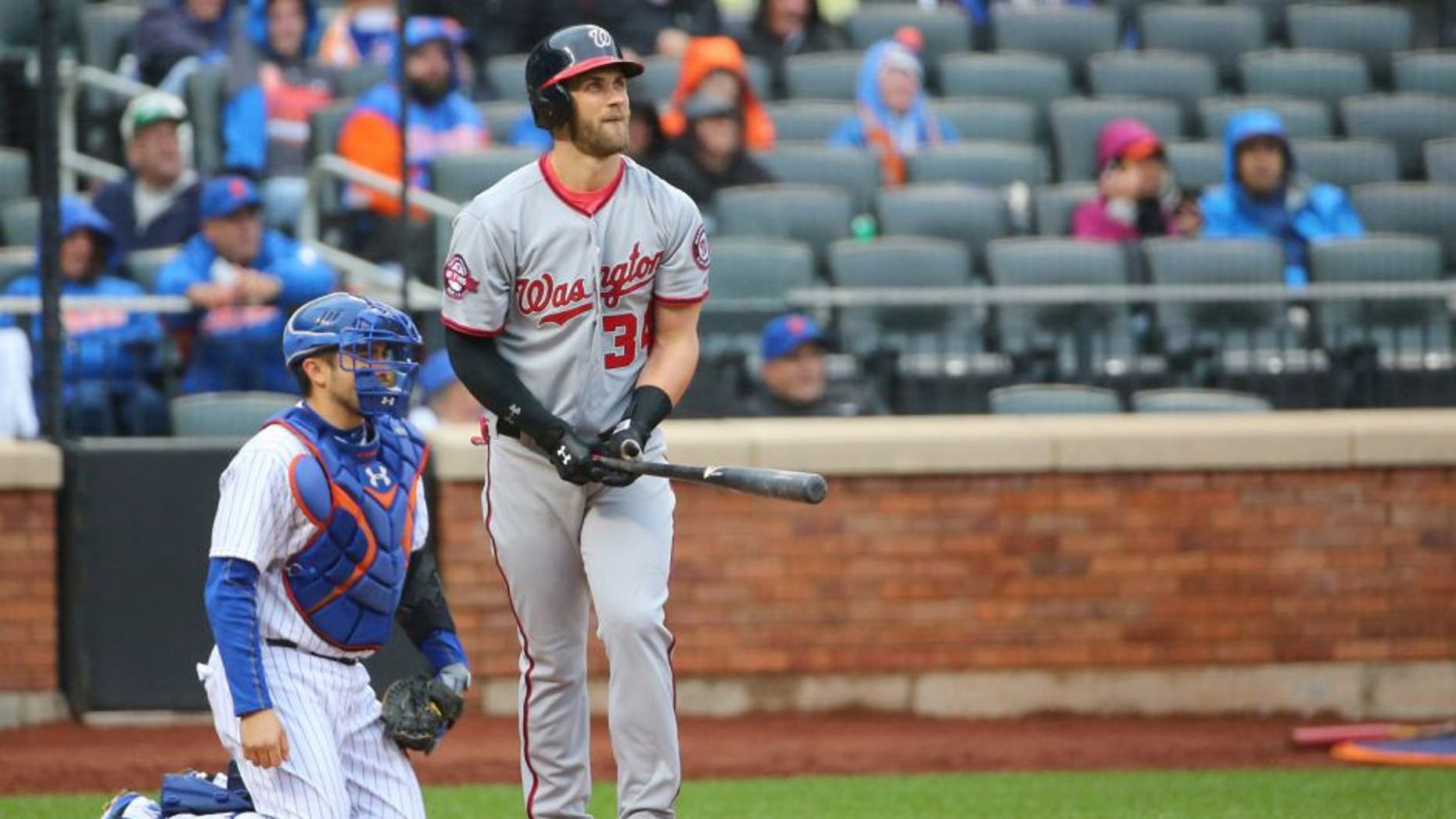 Oct 3, 2015; New York City, NY, USA; Washington Nationals right fielder Bryce Harper (34) watches his home run ball during the eighth inning against the New York Mets at Citi Field. Washington Nationals won 3-1. Mandatory Credit: Anthony Gruppuso-USA TODAY Sports
