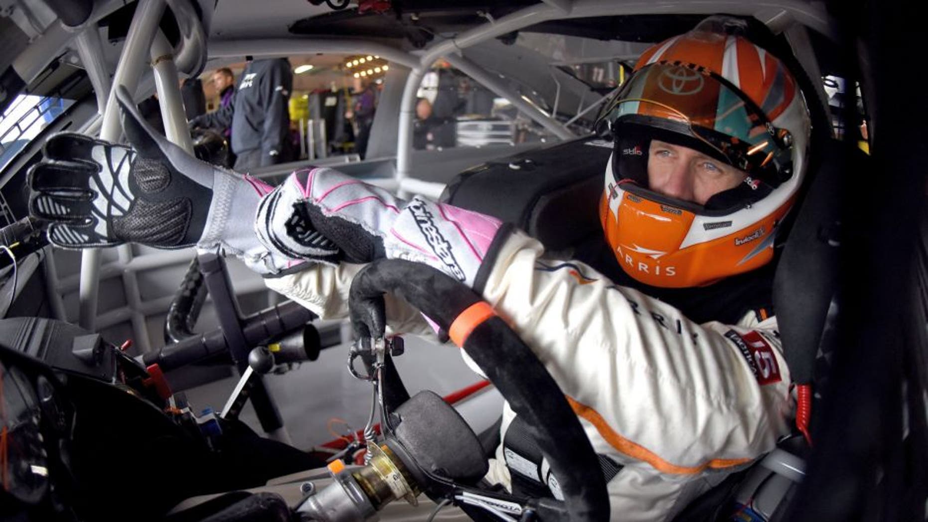 DOVER, DE - OCTOBER 03: Carl Edwards, driver of the #19 ARRIS Toyota, sits in his car in the garage area during practice for the NASCAR Sprint Cup Series AAA 400 at Dover International Speedway on October 3, 2015 in Dover, Delaware. (Photo by Jonathan Moore/Getty Images)