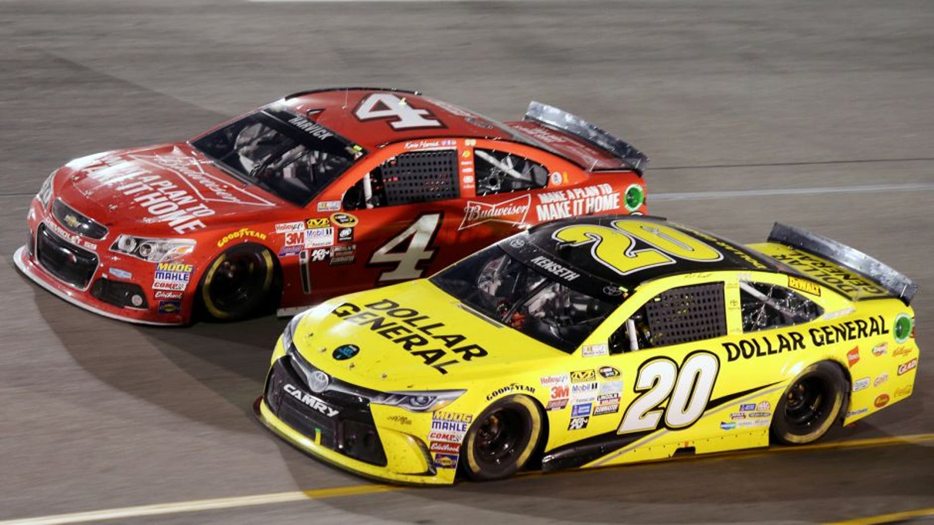 Matt Kenseth, driver of the #20 Dollar General Toyota, races Kevin Harvick, driver of the #4 Budweiser/Jimmy John's Chevrolet, during the NASCAR Sprint Cup Series Federated Auto Parts 400 at Richmond International Raceway on September 12, 2015 in Richmond, Virginia. (Photo by Jerry Markland/Getty Images)