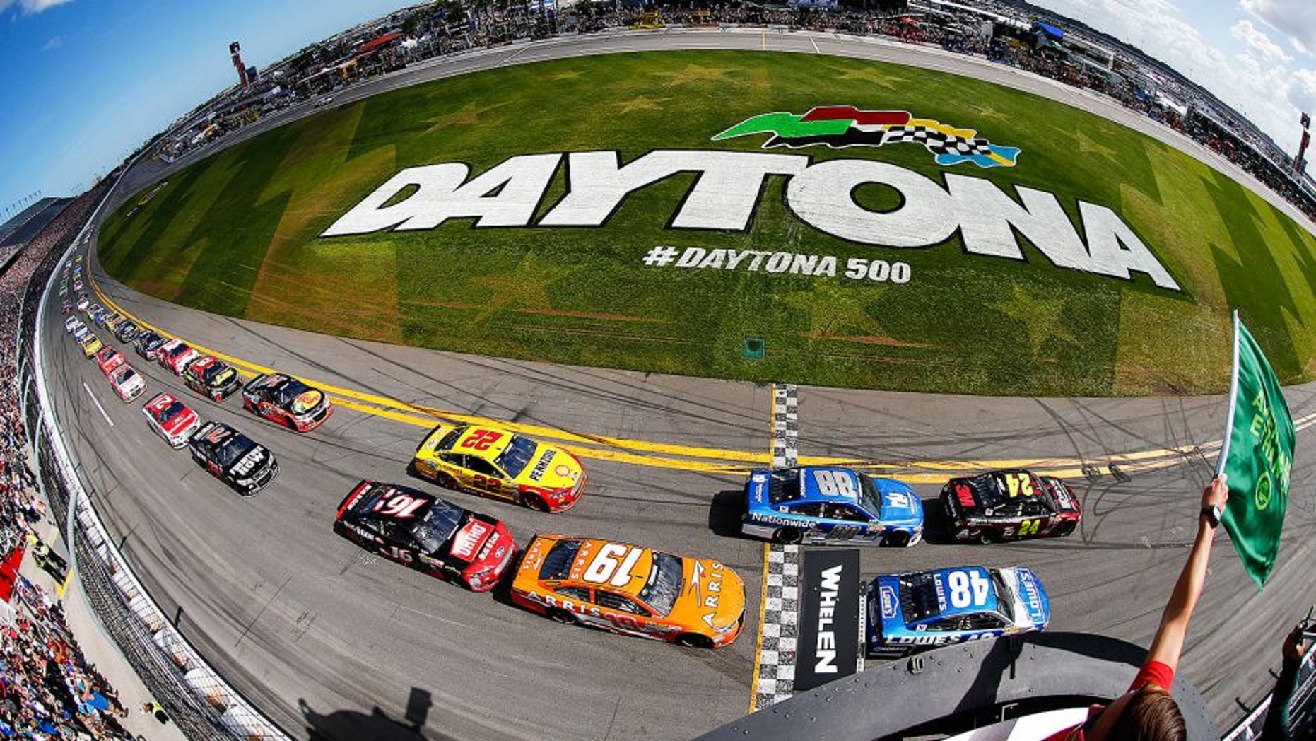 DAYTONA BEACH, FL - FEBRUARY 22: Jeff Gordon, driver of the #24 Drive To End Hunger Chevrolet, and Jimmie Johnson, driver of the #48 Lowe's Chevrolet, lead the field to the green flag for the running of the NASCAR Sprint Cup Series 57th Annual Daytona 500 at Daytona International Speedway on February 22, 2015 in Daytona Beach, Florida. (Photo by Jonathan Ferrey/NASCAR via Getty Images)