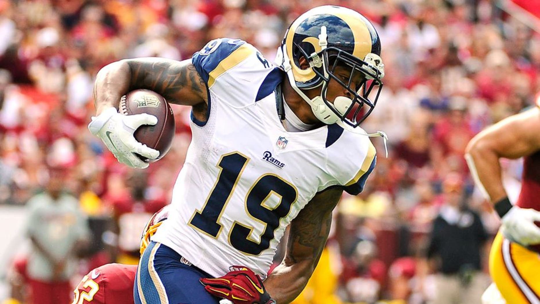 Sep 20, 2015; Landover, MD, USA; St. Louis Rams wide receiver Chris Givens (19) is tackled by Washington Redskins inside linebacker Keenan Robinson (52) during the second half at FedEx Field. The Washington Redskins won 24 - 10. Mandatory Credit: Brad Mills-USA TODAY Sports