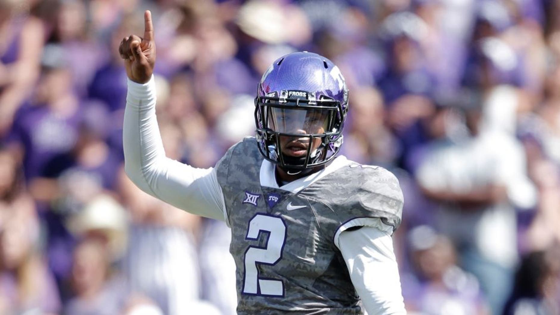 Oct 3, 2015; Fort Worth, TX, USA; Texas Christian University Horned Frogs quarterback Trevone Boykin (2) celebrates a first down against the University of Texas Longhorns in the third quarter at Amon G. Carter Stadium. Mandatory Credit: Erich Schlegel-USA TODAY Sports