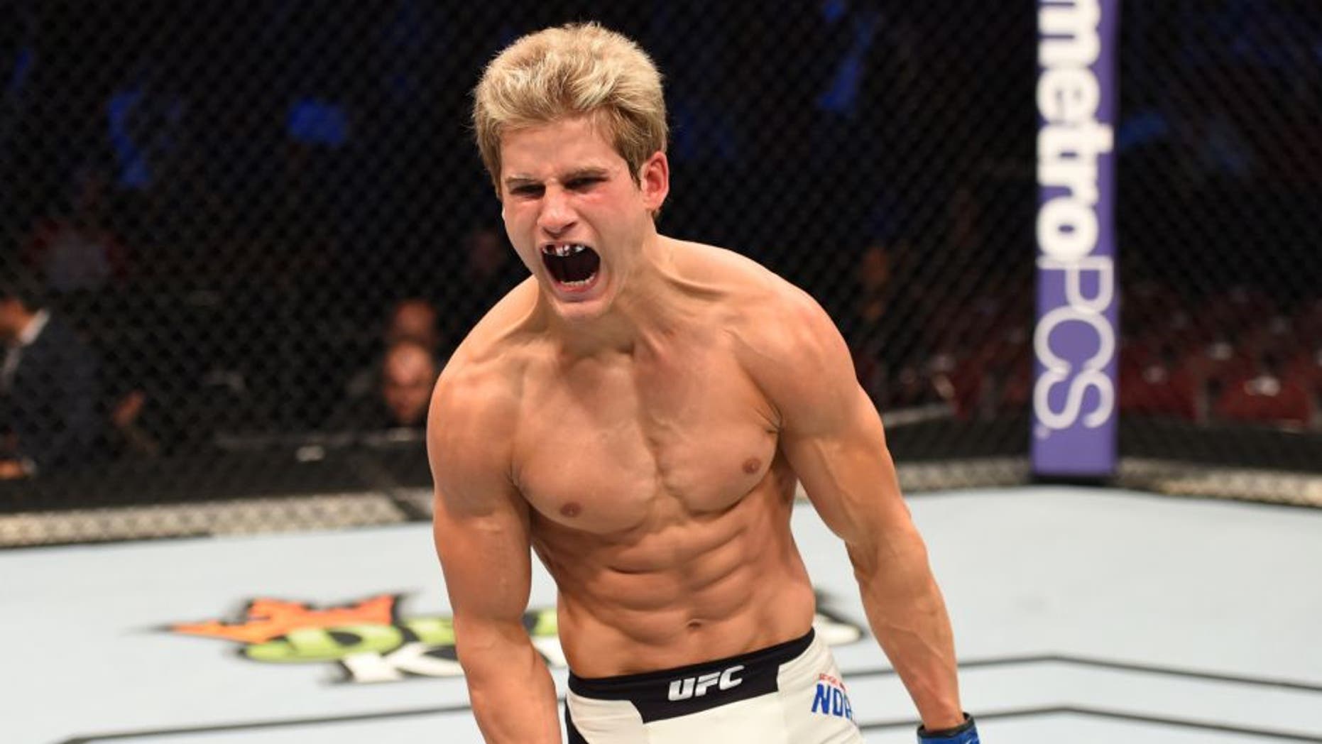 HOUSTON, TX - OCTOBER 03: Sage Northcutt celebrates his victory over Francisco Trevino in their lightweight bout during the UFC 192 event at the Toyota Center on October 3, 2015 in Houston, Texas. (Photo by Josh Hedges/Zuffa LLC/Zuffa LLC via Getty Images)