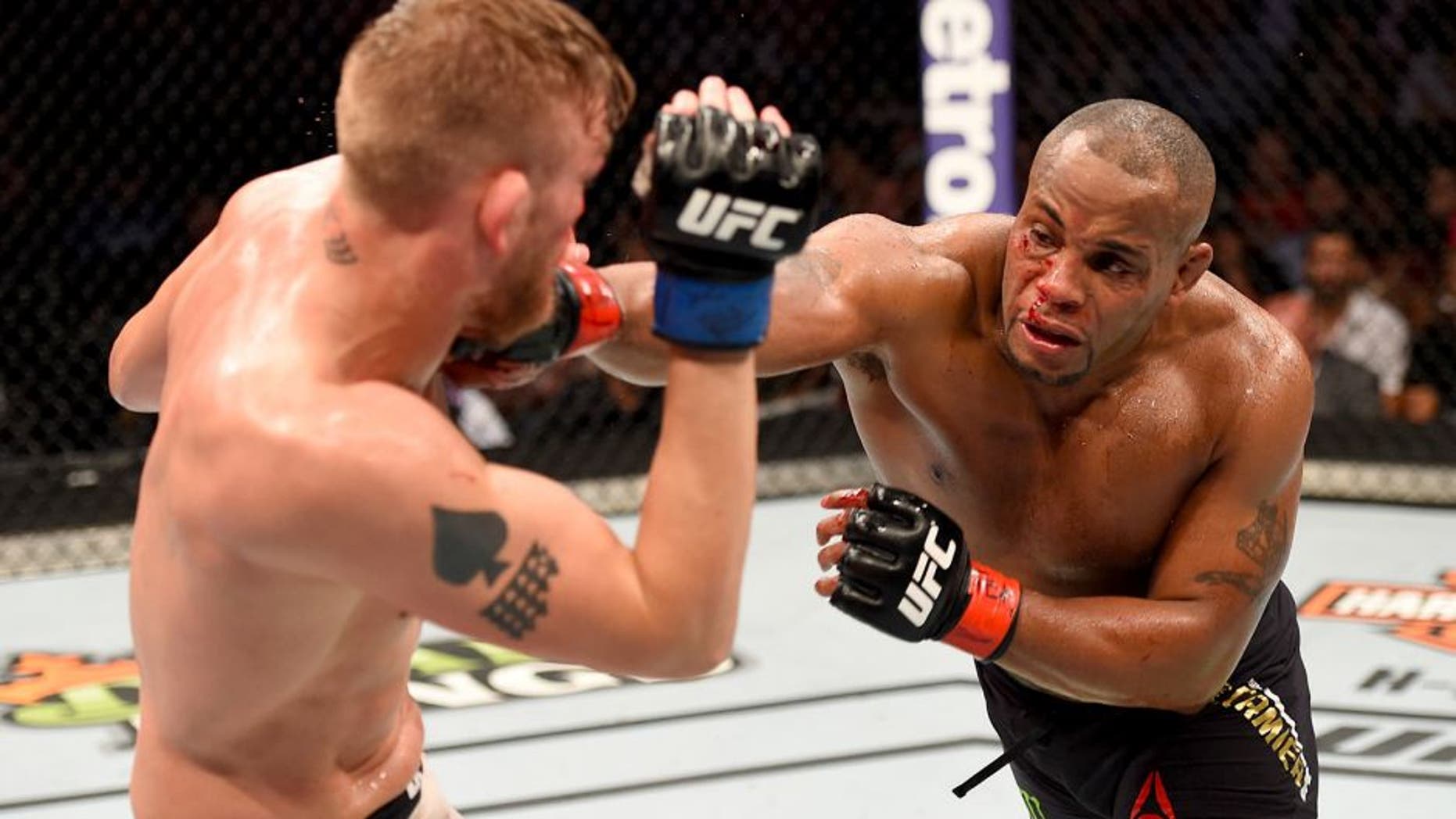 HOUSTON, TX - OCTOBER 03: (R-L) Daniel Cormier punches Alexander Gustafsson in their UFC light heavyweight championship bout during the UFC 192 event at the Toyota Center on October 3, 2015 in Houston, Texas. (Photo by Josh Hedges/Zuffa LLC/Zuffa LLC via Getty Images)