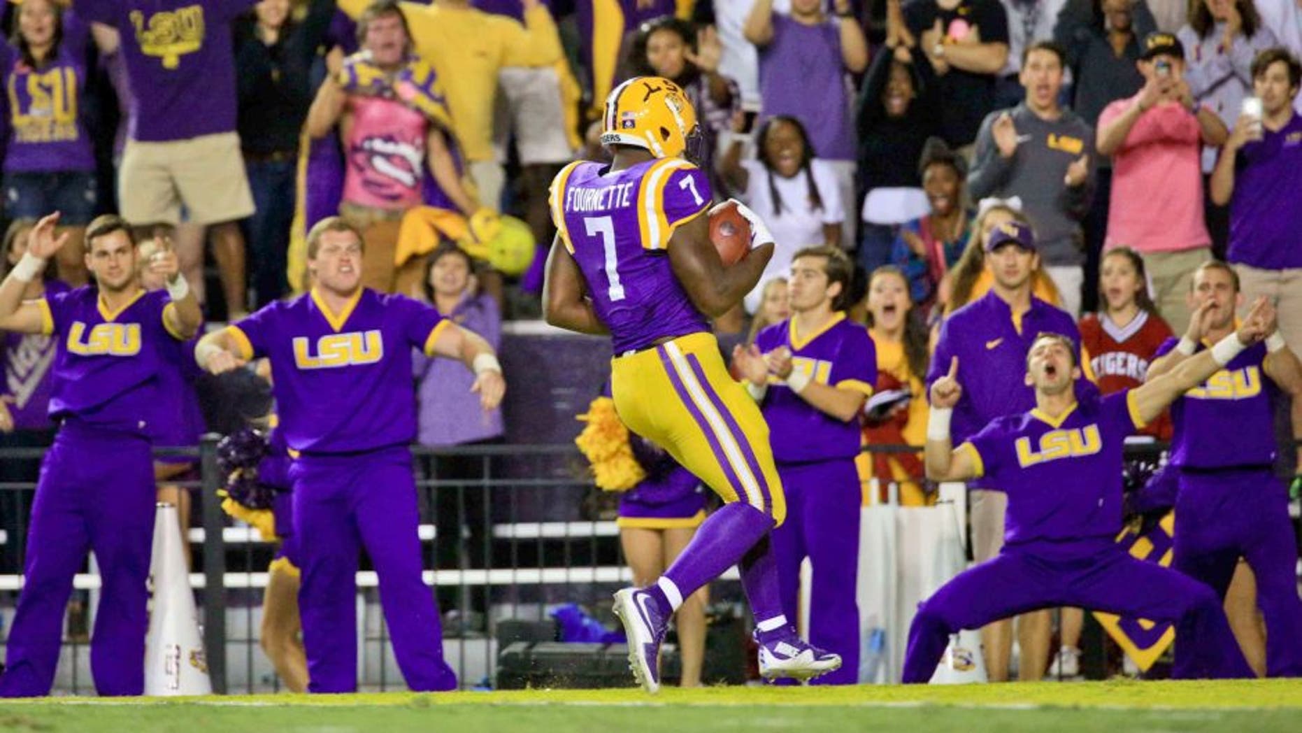 Oct 3, 2015; Baton Rouge, LA, USA; LSU Tigers running back Leonard Fournette (7) runs for a 75 yard touchdown against the Eastern Michigan Eagles during the third quarter of a game at Tiger Stadium. LSU defeated Eastern Michigan 44-22. Mandatory Credit: Derick E. Hingle-USA TODAY Sports