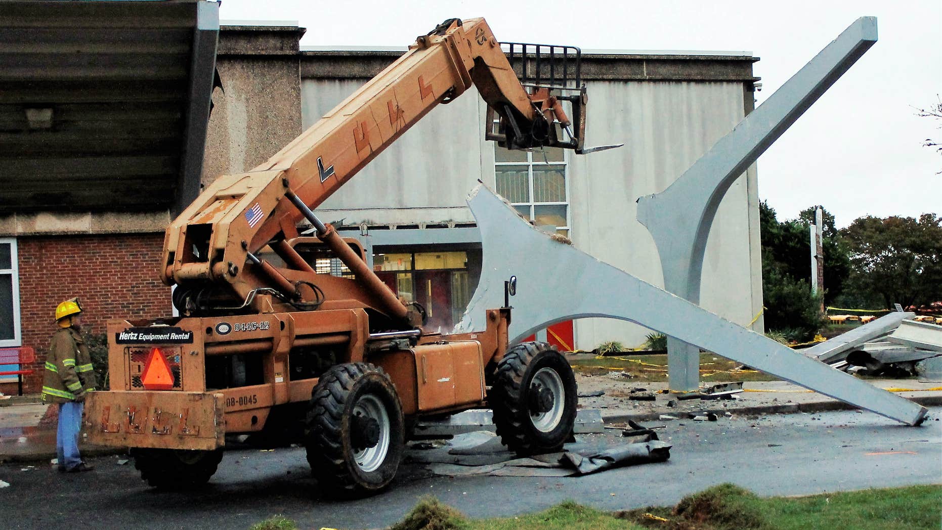 Oct. 3, 2015: he remains of a concrete canopy that collapsed sit in front of North Iredell High School in Olin, N.C.
