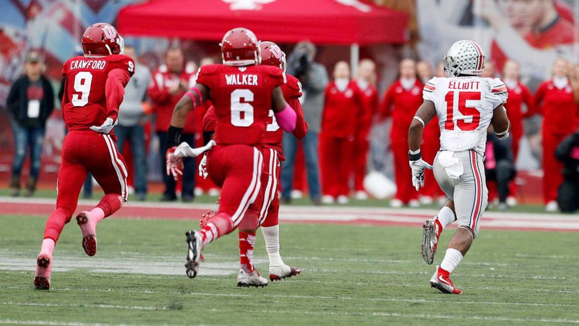 Oct 3, 2015; Bloomington, IN, USA; Ohio State Buckeyes running back Ezekiel Elliott (15) scores a touchdown on a long run from scrimmage against the Indiana Hoosiers at Memorial Stadium. Ohio State defeats Indiana 34-27. Mandatory Credit: Brian Spurlock-USA TODAY Sports