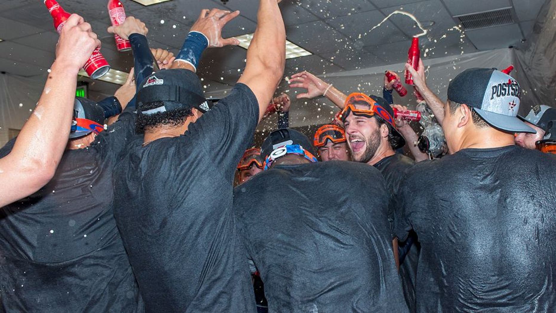 PHOENIX, AZ - OCTOBER 4: Jake Marisnick #6 of the Houston Astros celebrates with his team after clinching a wild card position in the American League playoffs after a MLB game against the Arizona Diamondbacks on October 4, 2015 at Chase Field in Phoenix, Arizona. (Photo by Darin Wallentine/Getty Images)