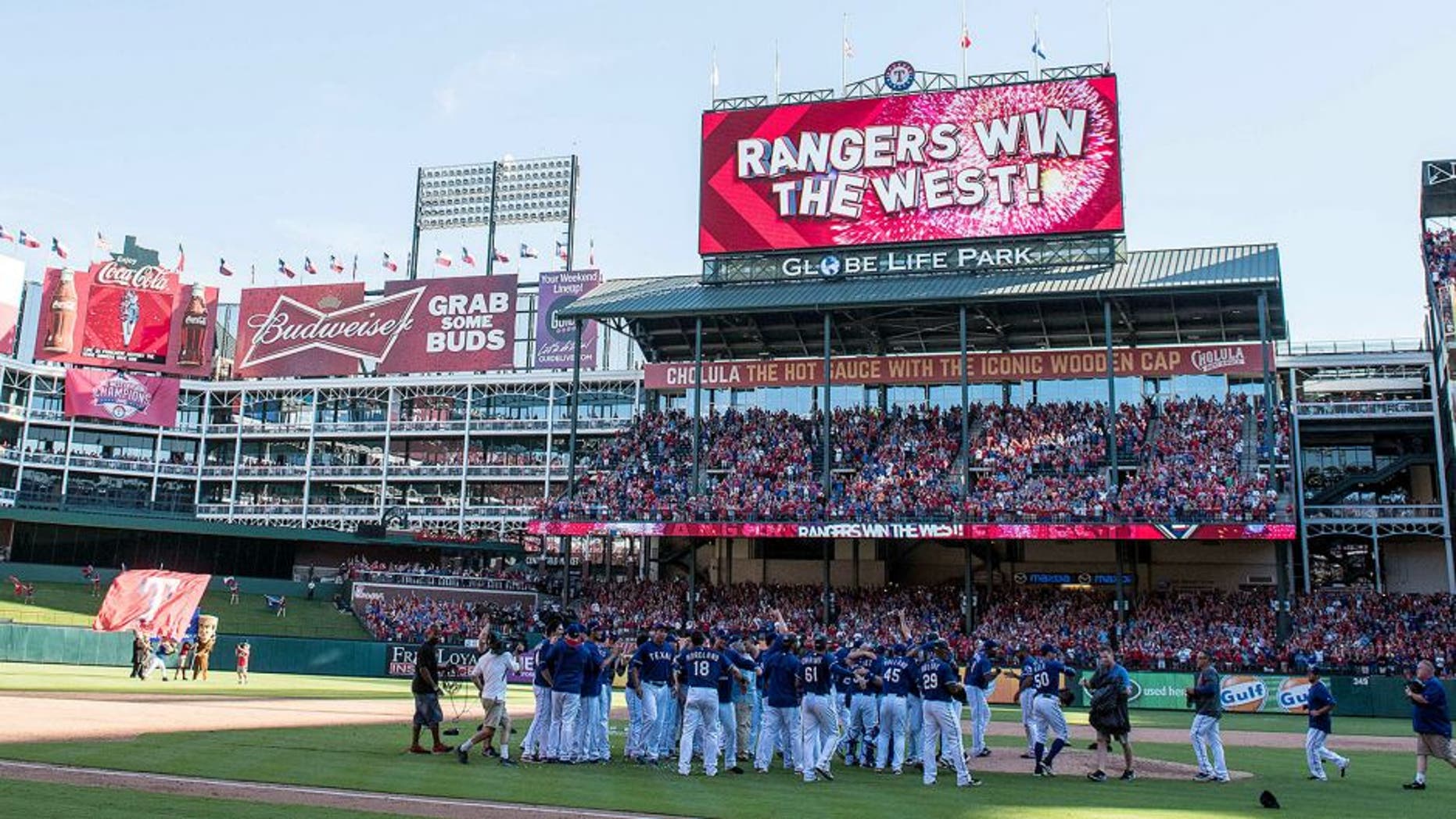 Oct 4, 2015; Arlington, TX, USA; The Texas Rangers celebrate their win over the Los Angeles Angels at Globe Life Park in Arlington. The Texas Rangers defeat the Angels 9-2 and clinch the American League West division. Mandatory Credit: Jerome Miron-USA TODAY Sports