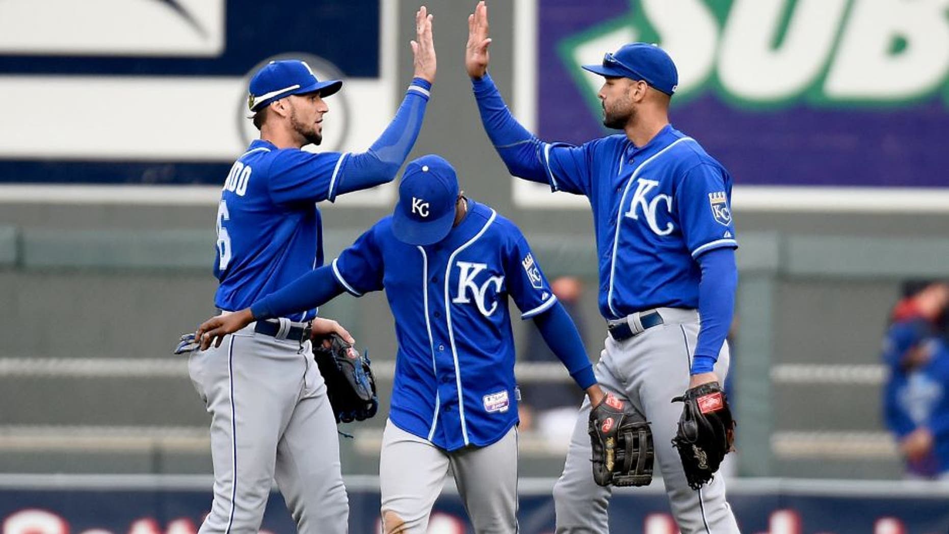 MINNEAPOLIS, MN - OCTOBER 4: (L-R) Paulo Orlando #16, Jarrod Dyson #1 and Alex Rios #15 of the Kansas City Royals celebrate a win of the game against the Minnesota Twins on October 4, 2015 at Target Field in Minneapolis, Minnesota. The Royals defeated the Twins 6-1. (Photo by Hannah Foslien/Getty Images)