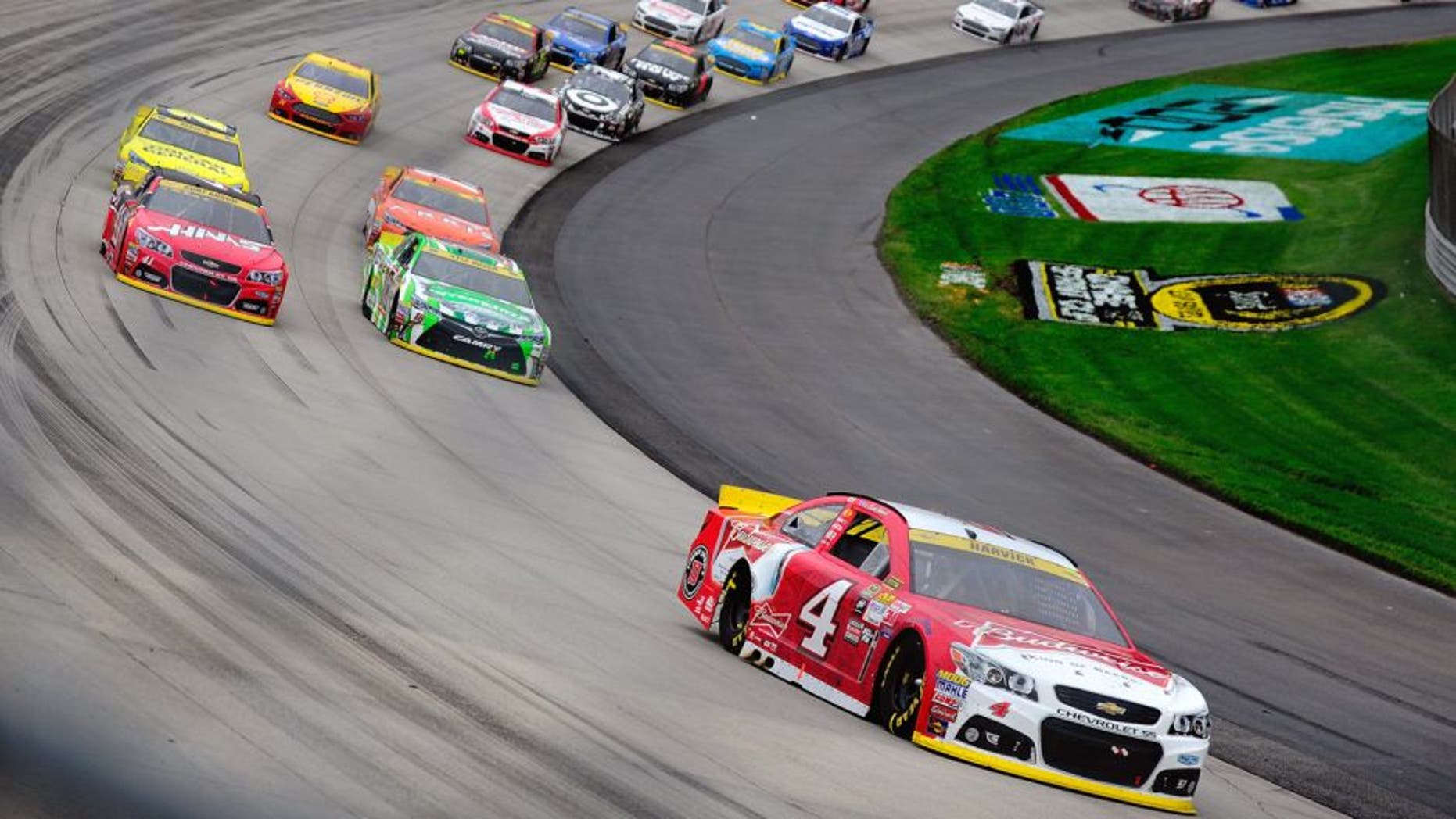 Kevin Harvick, driver of the #4 Budweiser/Jimmy John's Chevrolet, leads a pack of cars during the NASCAR Sprint Cup Series AAA 400 at Dover International Speedway on October 4, 2015 in Dover, Delaware. (Photo by Jeff Curry/Getty Images)