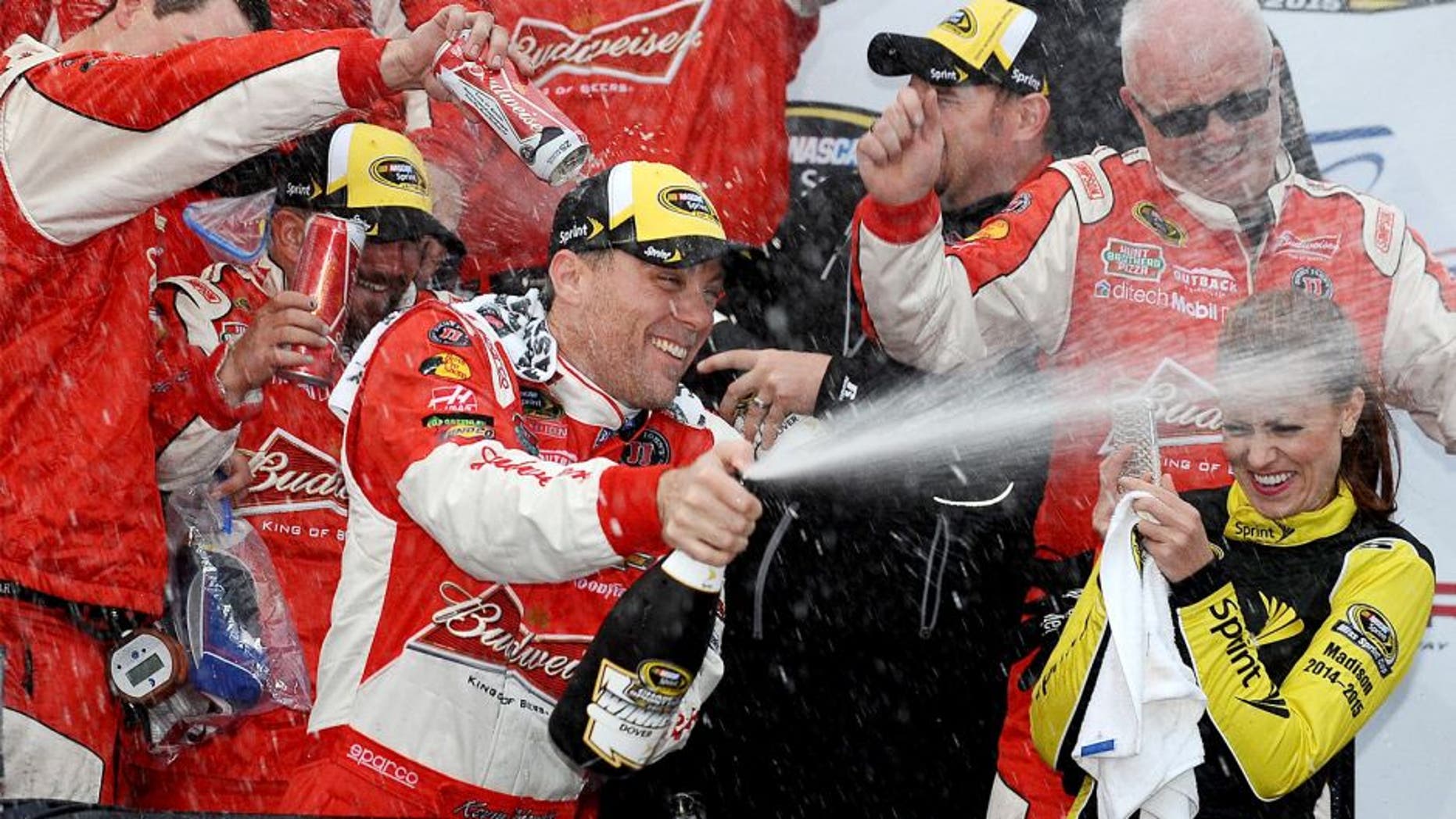 DOVER, DE - OCTOBER 04: Kevin Harvick, driver of the #4 Budweiser/Jimmy John's Chevrolet, celebrates in victory lane after winning the NASCAR Sprint Cup Series AAA 400 at Dover International Speedway on October 4, 2015 in Dover, Delaware. (Photo by Rainier Ehrhardt/NASCAR via Getty Images)