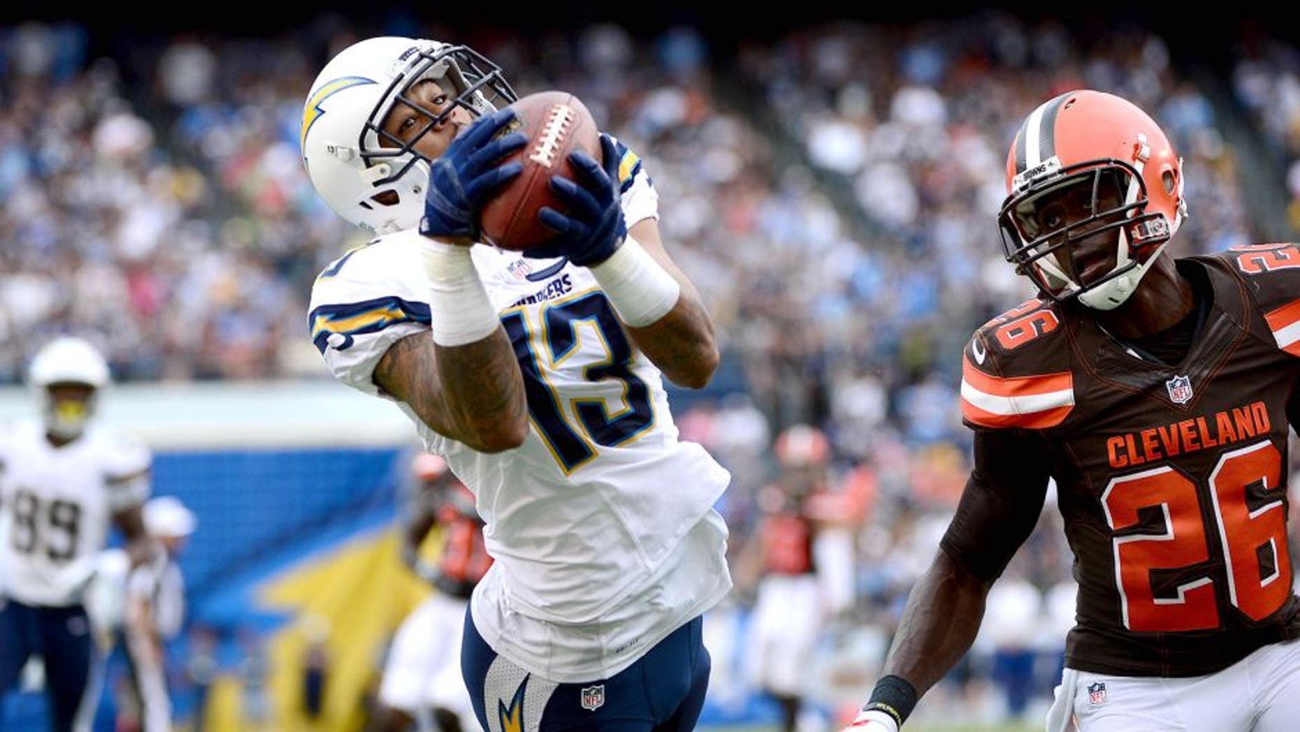 SAN DIEGO, CA- OCTOBER 4: Wide Receiver Keenan Allen #13 of the San Diego Chargers catches the ball for a touchdown while Pierre Desir #26 defends during the first quarter of their NFL Game on October 4, 2015 in San Diego, California. (Photo by Donald Miralle/Getty Images)