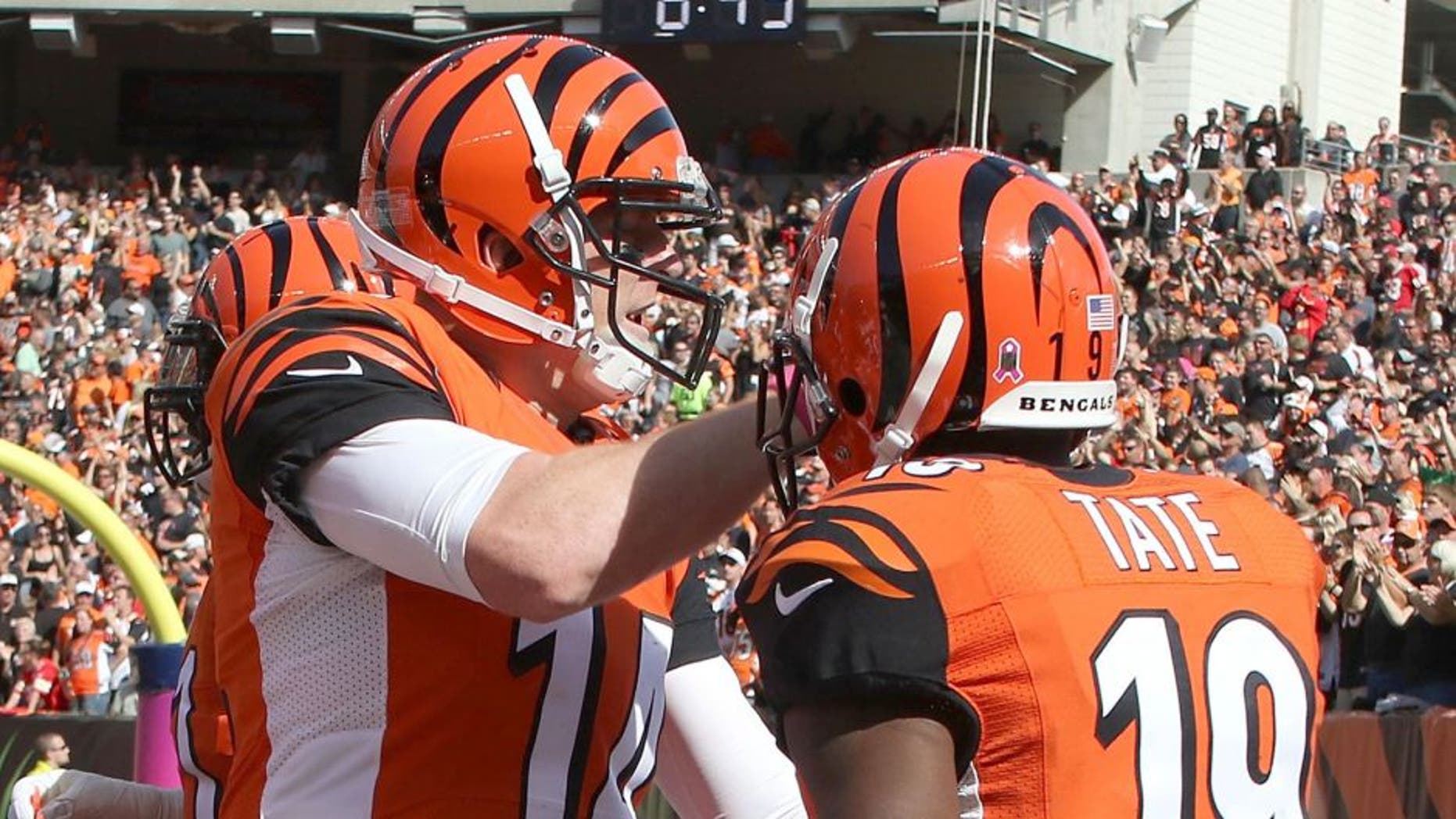 CINCINNATI, OH - OCTOBER 4: Andy Dalton #14 of the Cincinnati Bengals congratulates Brandon Tate #19 of the Cincinnati Bengals after scoring a touchdown on a 55 yard reception during the third quarter of the game against the Kansas City Chiefs at Paul Brown Stadium on October 4, 2015 in Cincinnati, Ohio. (Photo by John Grieshop/Getty Images)