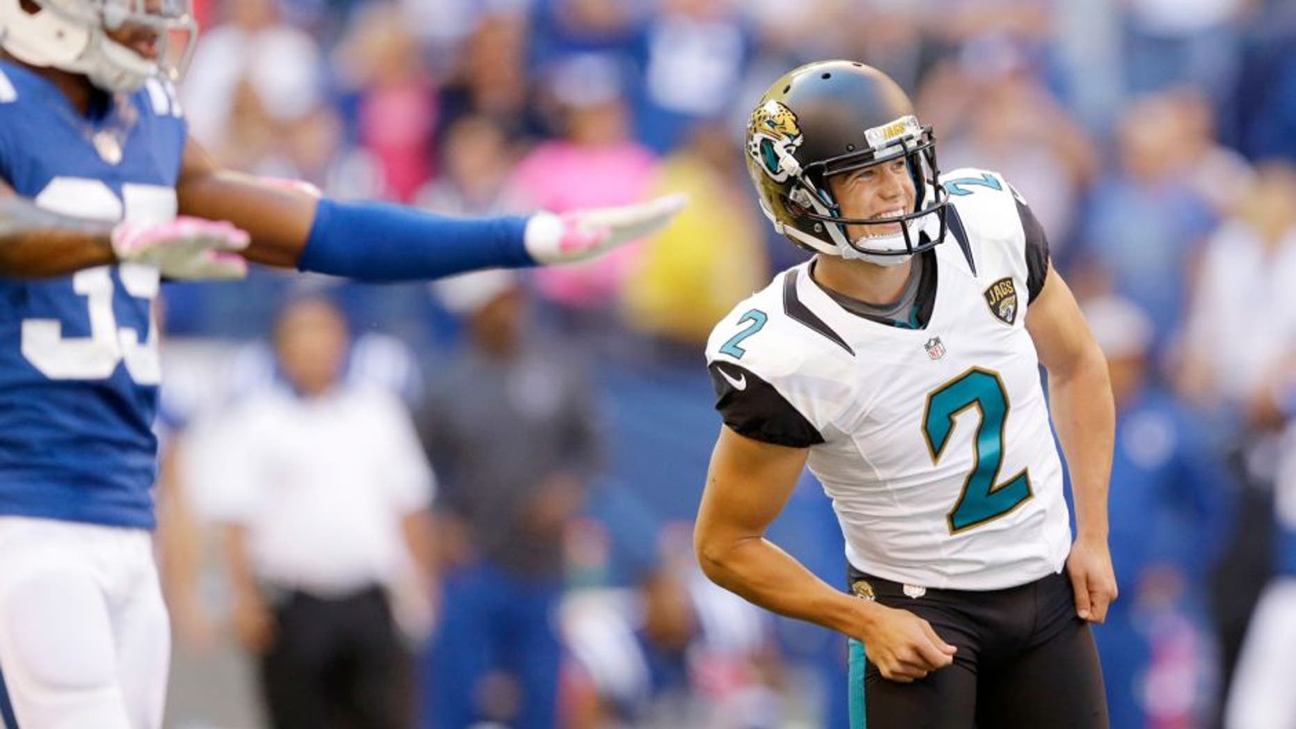 Jacksonville Jaguars' Jason Myers (2) watches as he misses a potential game winning field goal as Indianapolis Colts' Josh Thomas (35) reacts late in the second half of an NFL football game Sunday, Oct. 4, 2015, in Indianapolis. (AP Photo/Michael Conroy)