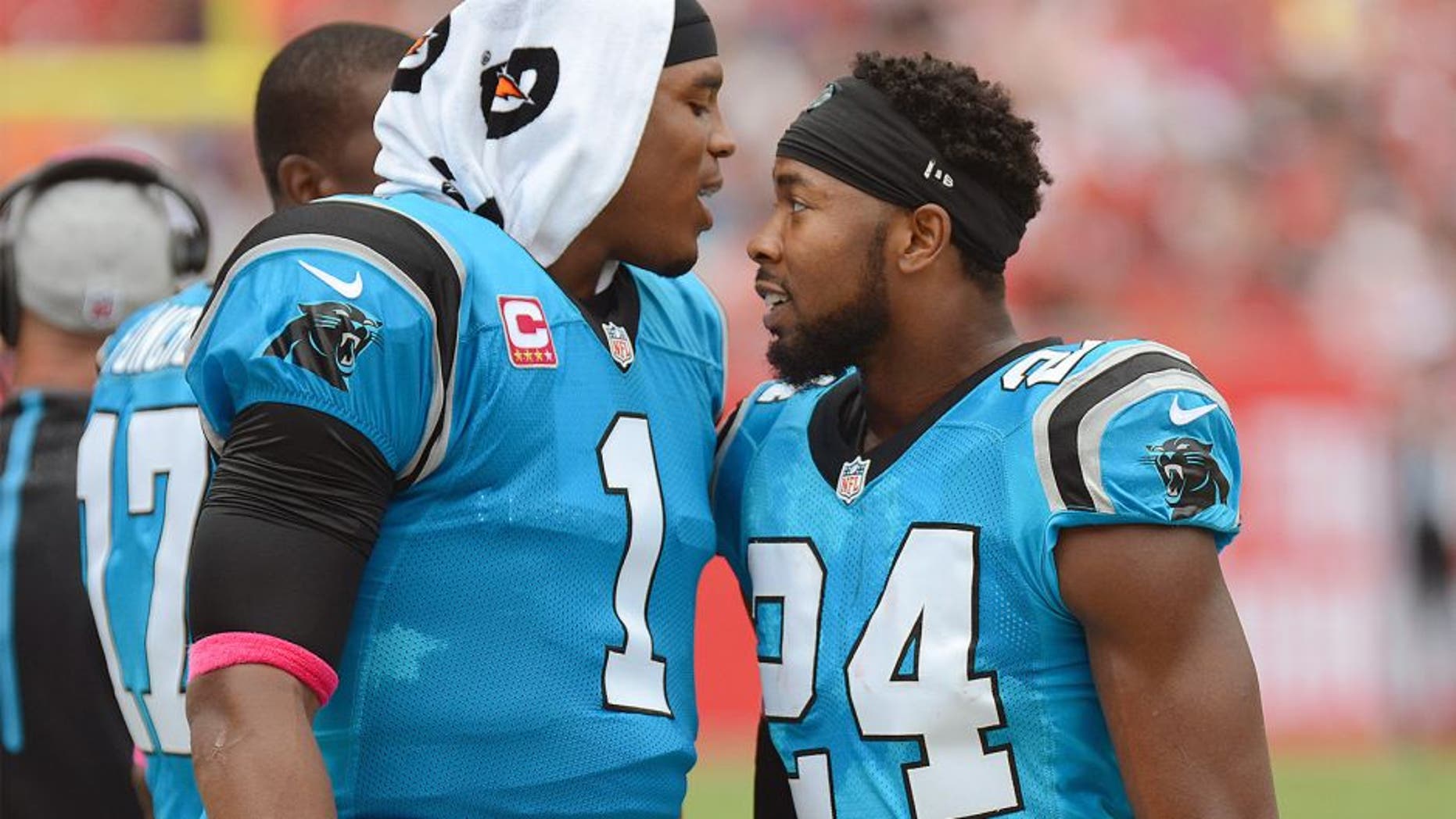 Oct 4, 2015; Tampa, FL, USA; Carolina Panthers defensive back Josh Norman (24) celebrates with Carolina Panthers quarterback Cam Newton (1) after a interception return for touchdown in the first half against the Tampa Bay Buccaneers at Raymond James Stadium. Mandatory Credit: Jonathan Dyer-USA TODAY Sports