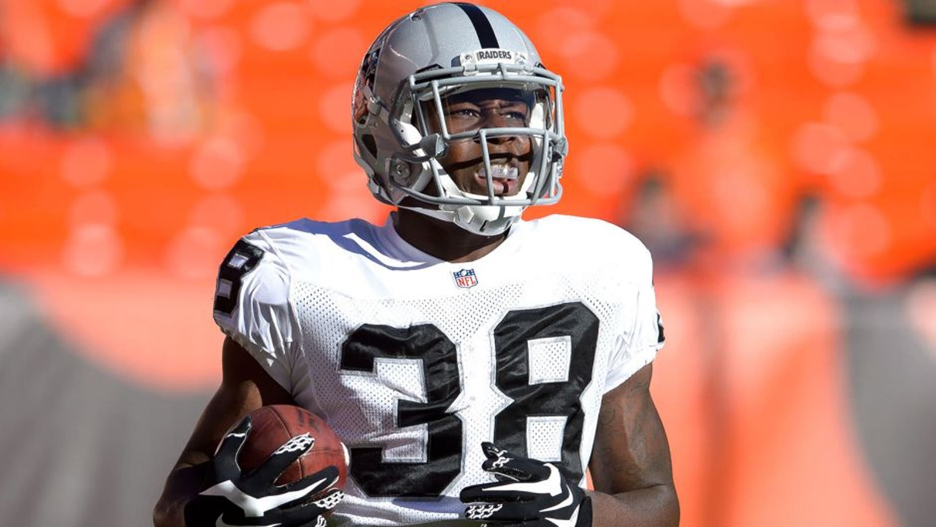 CLEVELAND, OH - OCTOBER 26: Cornerback T.J. Carrie #38 of the Oakland Raiders warms up prior to the game against the Cleveland Browns at FirstEnergy Stadium in Cleveland, Ohio. (Photo by Jason Miller/Getty Images)