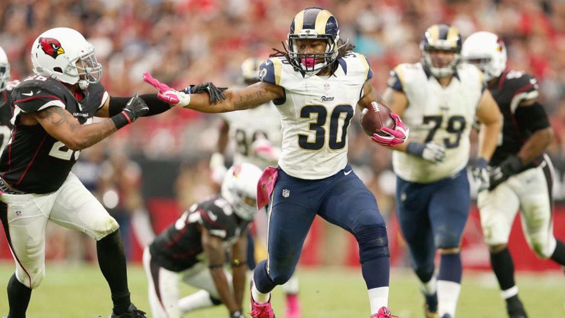 GLENDALE, AZ - OCTOBER 04: Running back Todd Gurley #30 of the St. Louis Rams runs past free safety Rashad Johnson #26 of the Arizona Cardinals during the second half of the NFL game at the University of Phoenix Stadium on October 4, 2015 in Glendale, Arizona. (Photo by Christian Petersen/Getty Images)