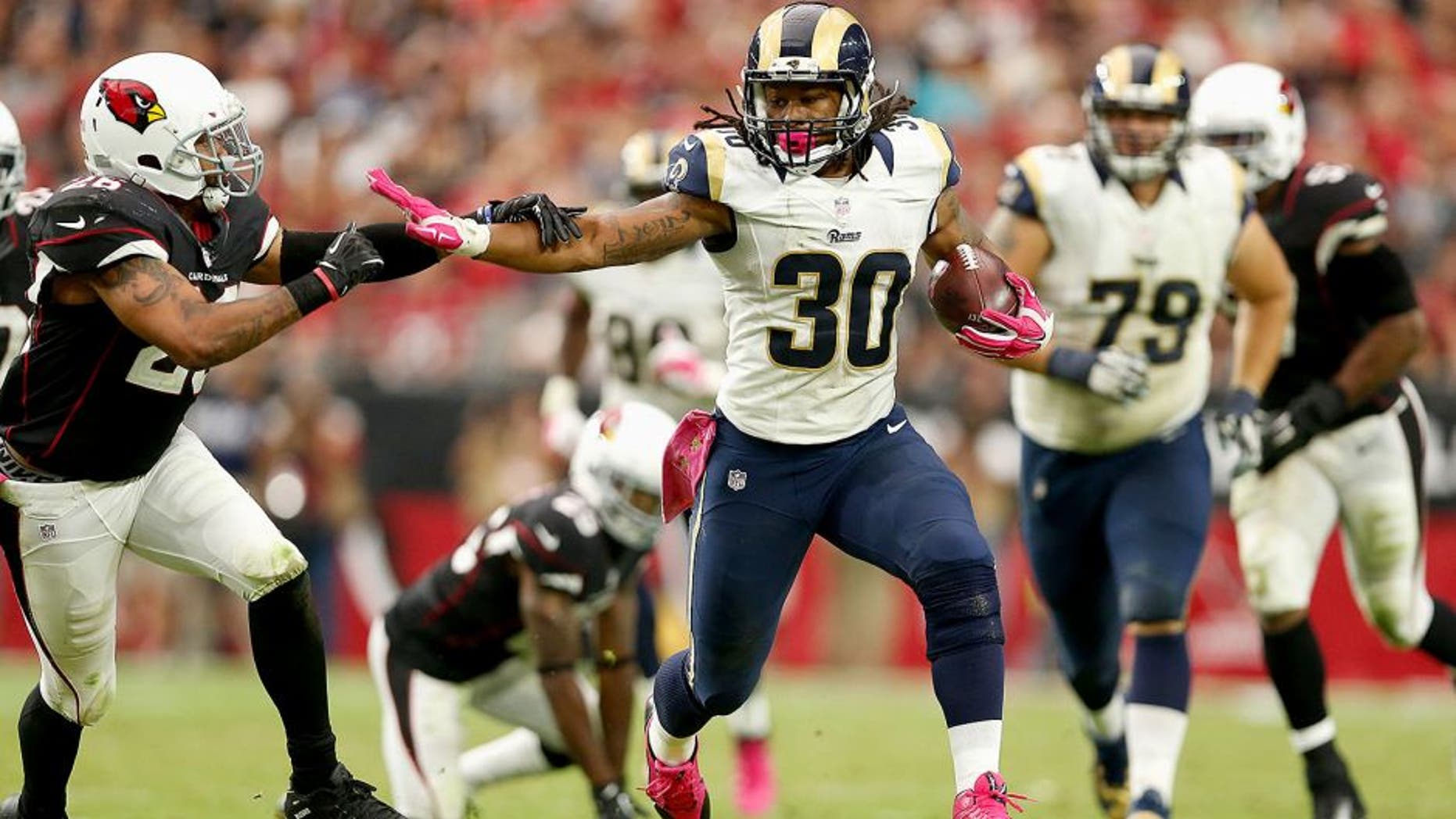 GLENDALE, AZ - OCTOBER 04: Running back Todd Gurley #30 of the St. Louis Rams runs past free safety Rashad Johnson #26 of the Arizona Cardinals during the second half of the NFL game at the University of Phoenix Stadium on October 4, 2015 in Glendale, Arizona. (Photo by Christian Petersen/Getty Images)