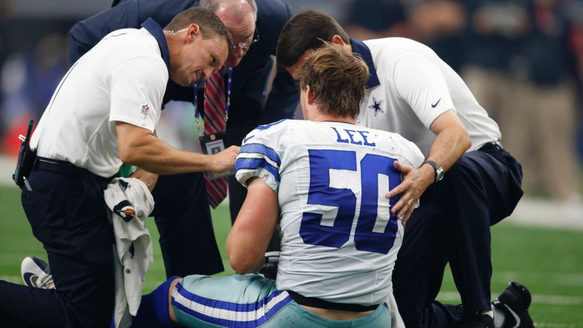 Sep 27, 2015; Arlington, TX, USA; Dallas Cowboys linebacker Sean Lee (50) is attended to after an injury in the third quarter against the Atlanta Falcons at AT&T Stadium. Mandatory Credit: Matthew Emmons-USA TODAY Sports