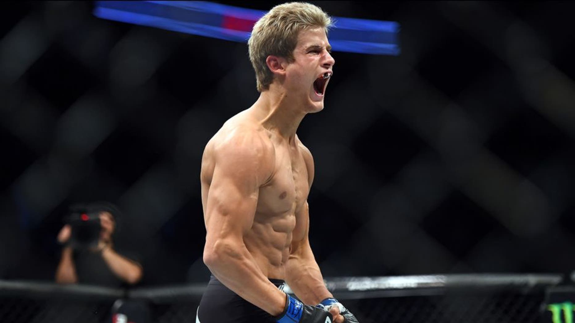 HOUSTON, TX - OCTOBER 03: Sage Northcutt celebrates after defeating Francisco Trevino in their lightweight bout during the UFC 192 event at the Toyota Center on October 3, 2015 in Houston, Texas. (Photo by Jeff Bottari/Zuffa LLC/Zuffa LLC via Getty Images)