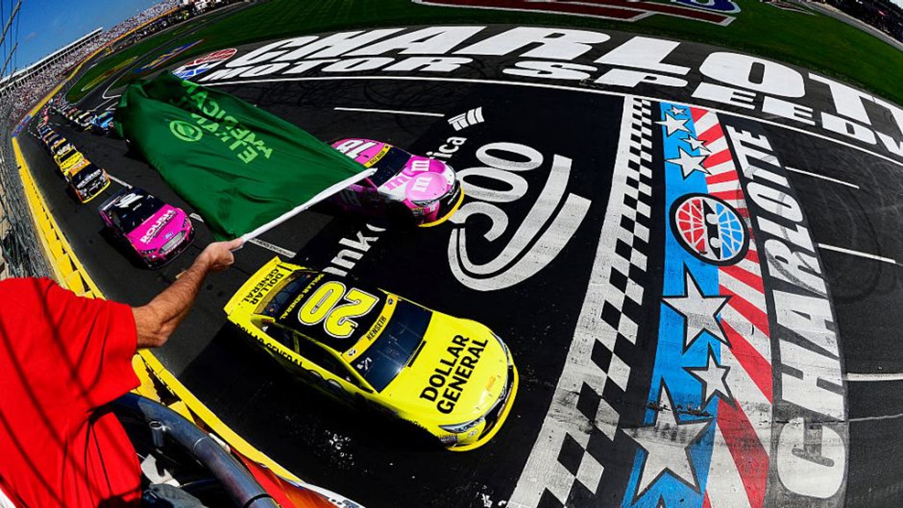 CHARLOTTE, NC - OCTOBER 11: Matt Kenseth, driver of the #20 Dollar General Toyota, and Kyle Busch, driver of the #18 M&M's Pretty In Pink Foundation Toyota, lead the field to the green flag to start the NASCAR Sprint Cup Series Bank of America 500 at Charlotte Motor Speedway on October 11, 2015 in Charlotte, North Carolina. (Photo by Robert Laberge/NASCAR via Getty Images)