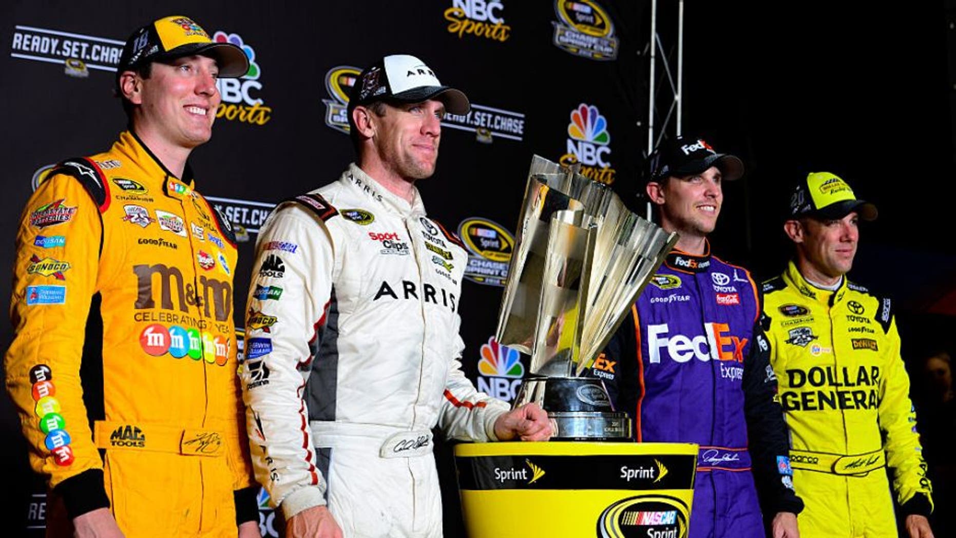 RICHMOND, VA - SEPTEMBER 10: Kyle Busch, driver of the #18 M&M's 75th Anniversary Toyota, Carl Edwards, driver of the #19 ARRIS Surfboard Toyota, Denny Hamlin, driver of the #11 FedEx Ground Toyota, and Matt Kenseth, driver of the #20 Dollar General Toyota, pose with the NASCAR Sprint Cup trophy after the NASCAR Sprint Cup Series Federated Auto Parts 400 at Richmond International Raceway on September 10, 2016 in Richmond, Virginia. (Photo by Robert Laberge/Getty Images)