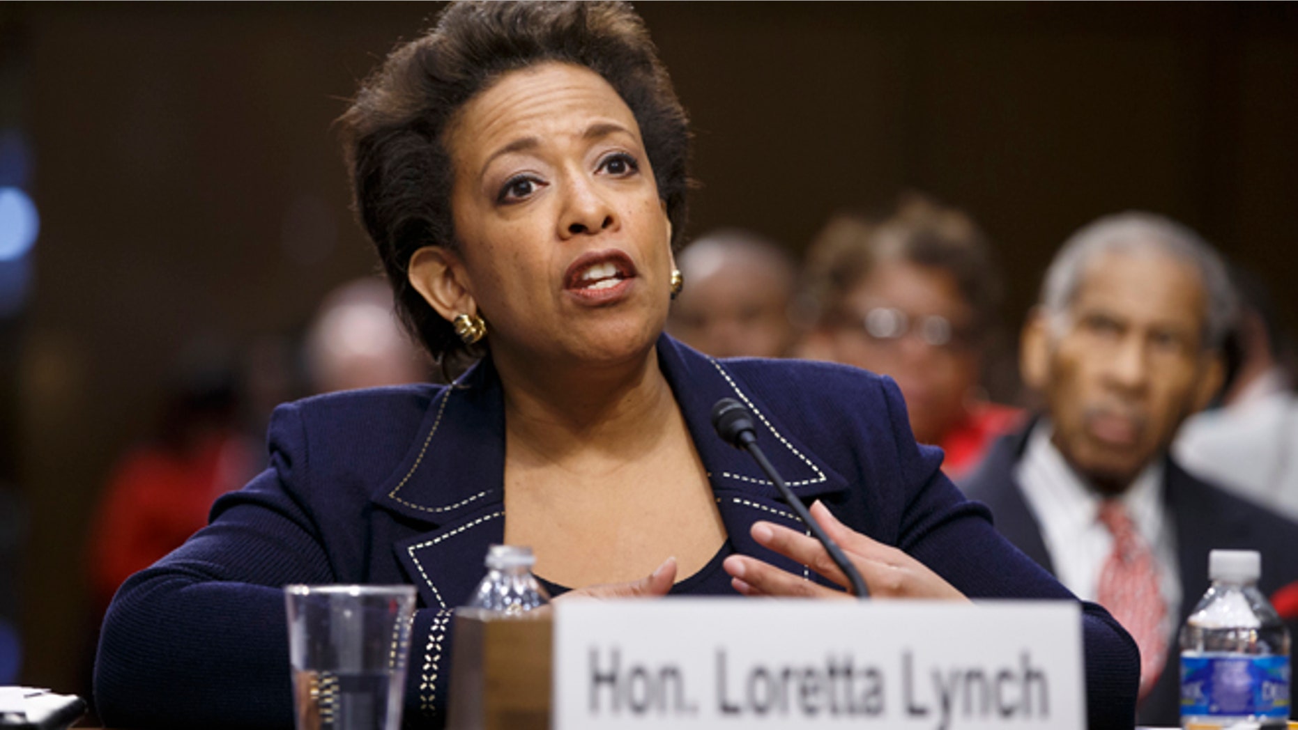 Attorney General nominee Loretta Lynch testifies on Capitol Hill in Washington, Wednesday, Jan. 28, 2015, before the Senate Judiciary Committee's hearing on her nomination. Lynch defended President Barack Obama's decision to shelter millions of immigrants from deportation though they live in the country illegally but she said they have no right to citizenship under the law. If confirmed, Lynch would become the nation's first black female attorney general. It is the first confirmation proceeding since Republicans took control of the Senate this month. (AP Photo/J. Scott Applewhite)