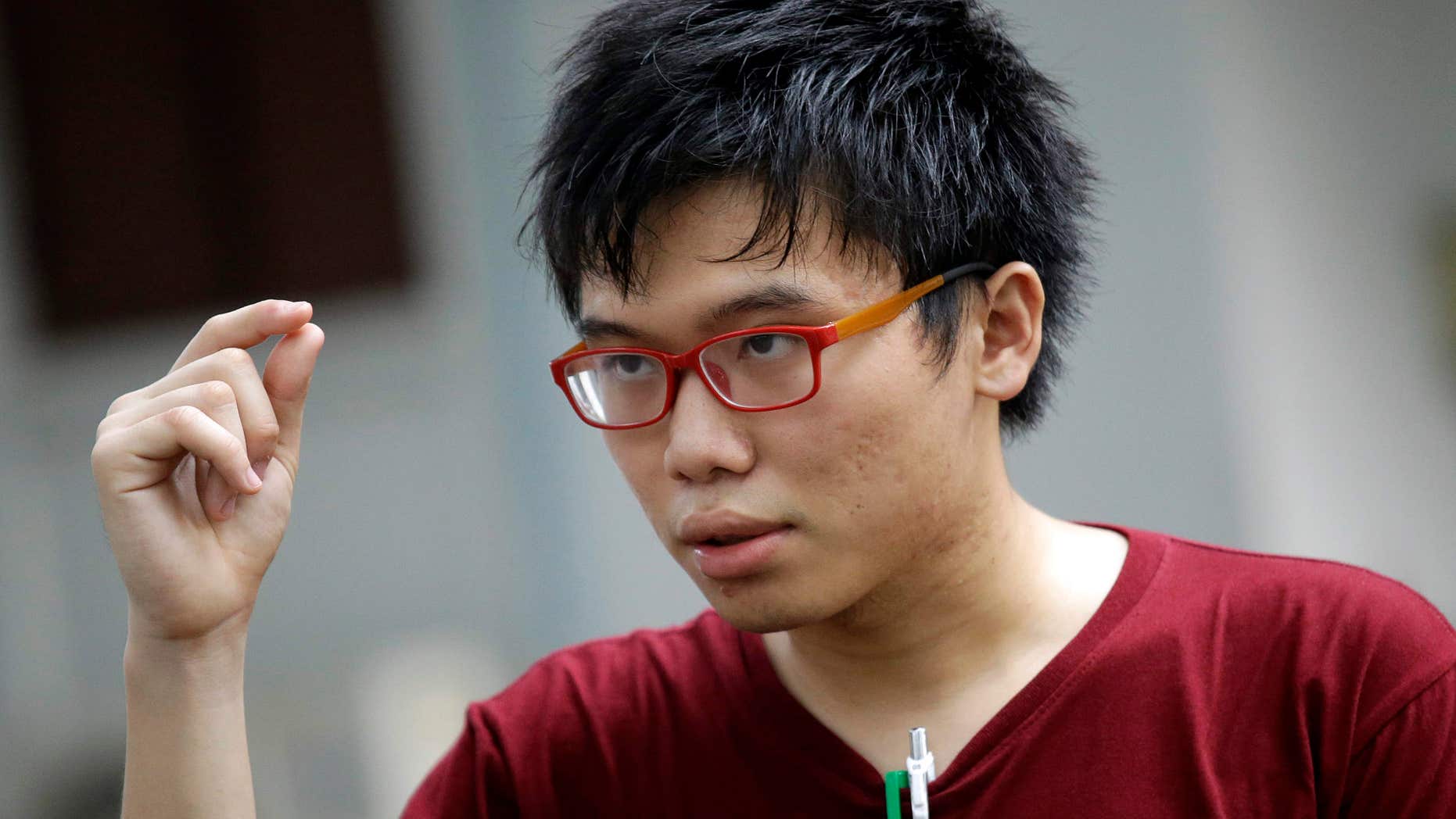 Oct. 5, 2016: Thai student activist Netiwit Chotipatpaisal gestures as he talks to the media on Hong Kong teen pro-democracy activist Joshua Wong's detention at Bangkok's airport, in Bangkok, Thailand.