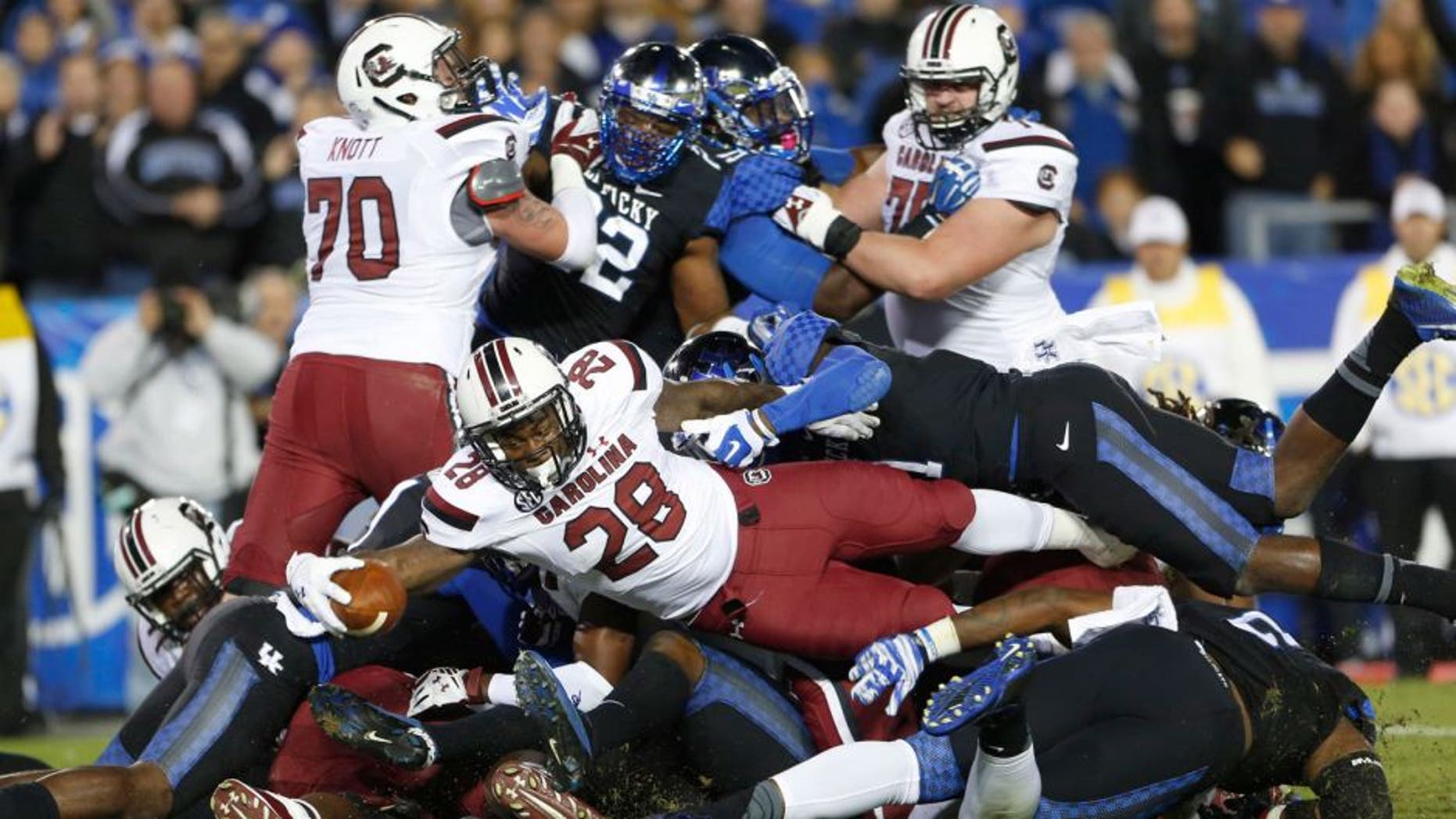 Oct 4, 2014; Lexington, KY, USA; South Carolina Gamecocks running back Mike Davis (28) scores a touchdown against the Kentucky Wildcats in the first half at Commonwealth Stadium. Mandatory Credit: Mark Zerof-USA TODAY Sports