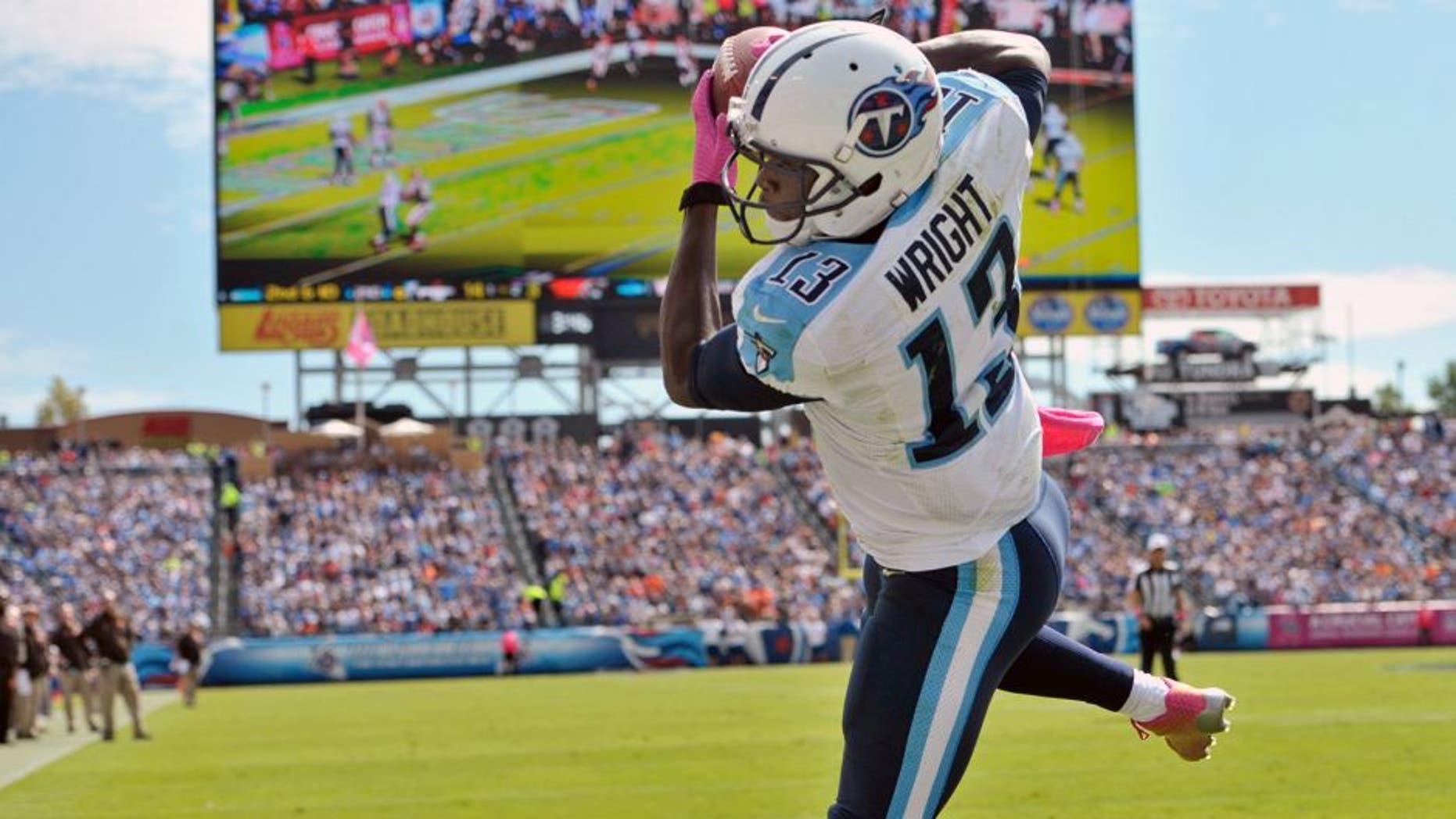 Oct 5, 2014; Nashville, TN, USA; Tennessee Titans wide receiver Kendall Wright (13) catches a touchdown pass against the Cleveland Browns during the first half at LP Field. Mandatory Credit: Jim Brown-USA TODAY Sports