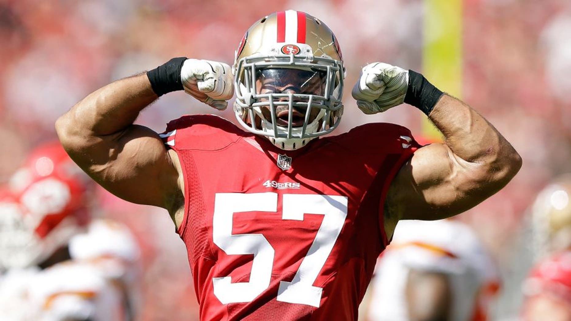SANTA CLARA, CA - OCTOBER 05: Michael Wilhoite #57 of the San Francisco 49ers flexes his muscles after making a tackled during their game against the Kansas City Chiefs at Levi's Stadium on October 5, 2014 in Santa Clara, California. (Photo by Ezra Shaw/Getty Images)